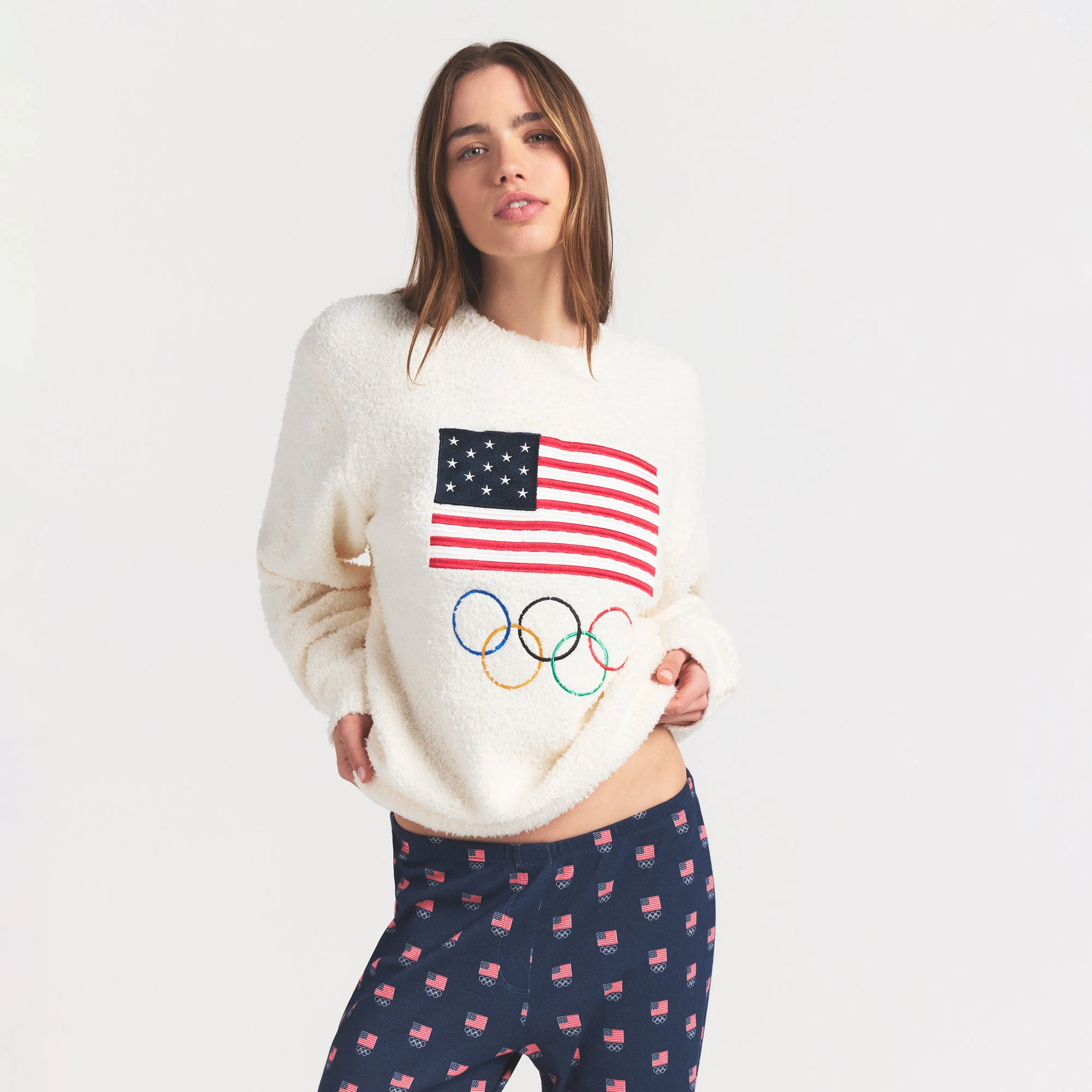SKIMS FOR TEAM USA COZY UNISEX OLYMPIC SLEEP TOP | ECRU ON A MODEL SIDE VIEW @ | FOCUS: 0.0, 1.0, 0.9