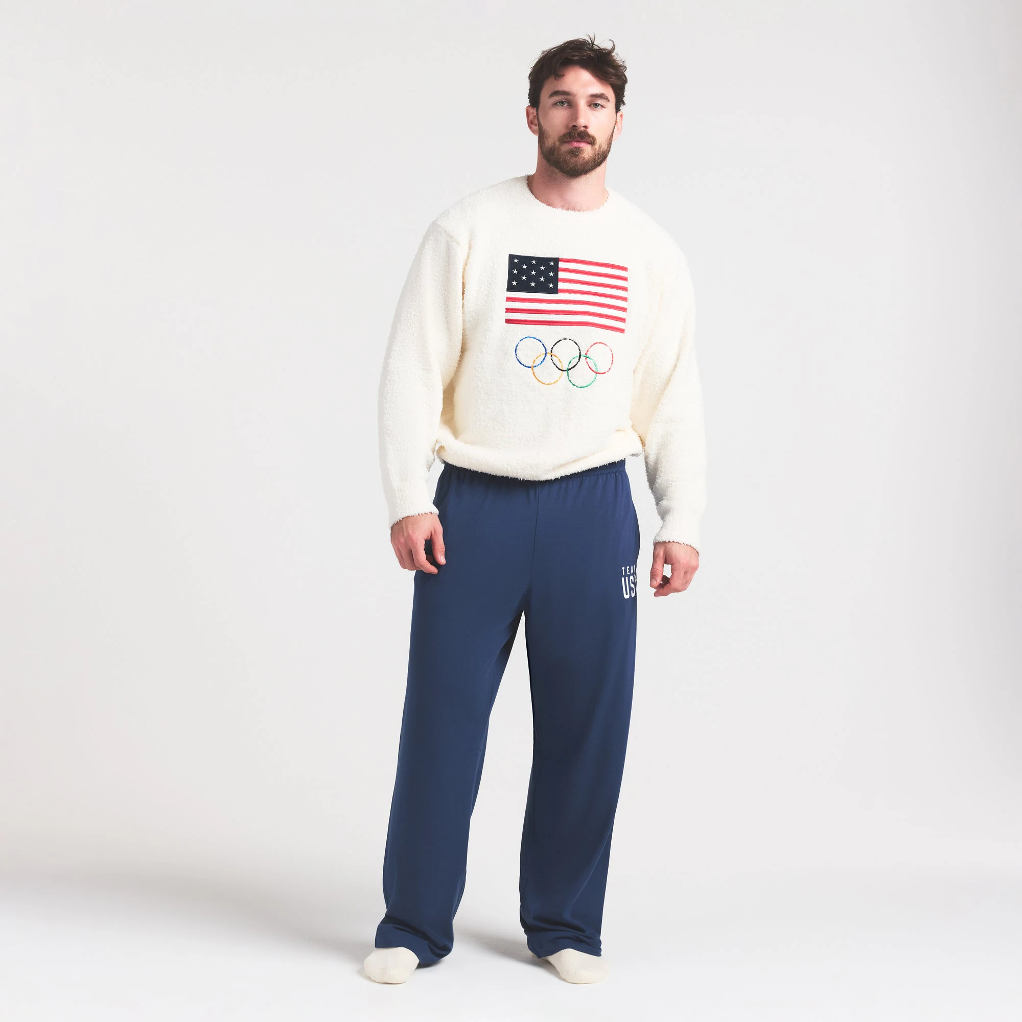 SKIMS FOR TEAM USA COZY UNISEX OLYMPIC SLEEP TOP | ECRU ON A MODEL FRONT VIEW @ | FOCUS: 0.0, 1.0, 0.9