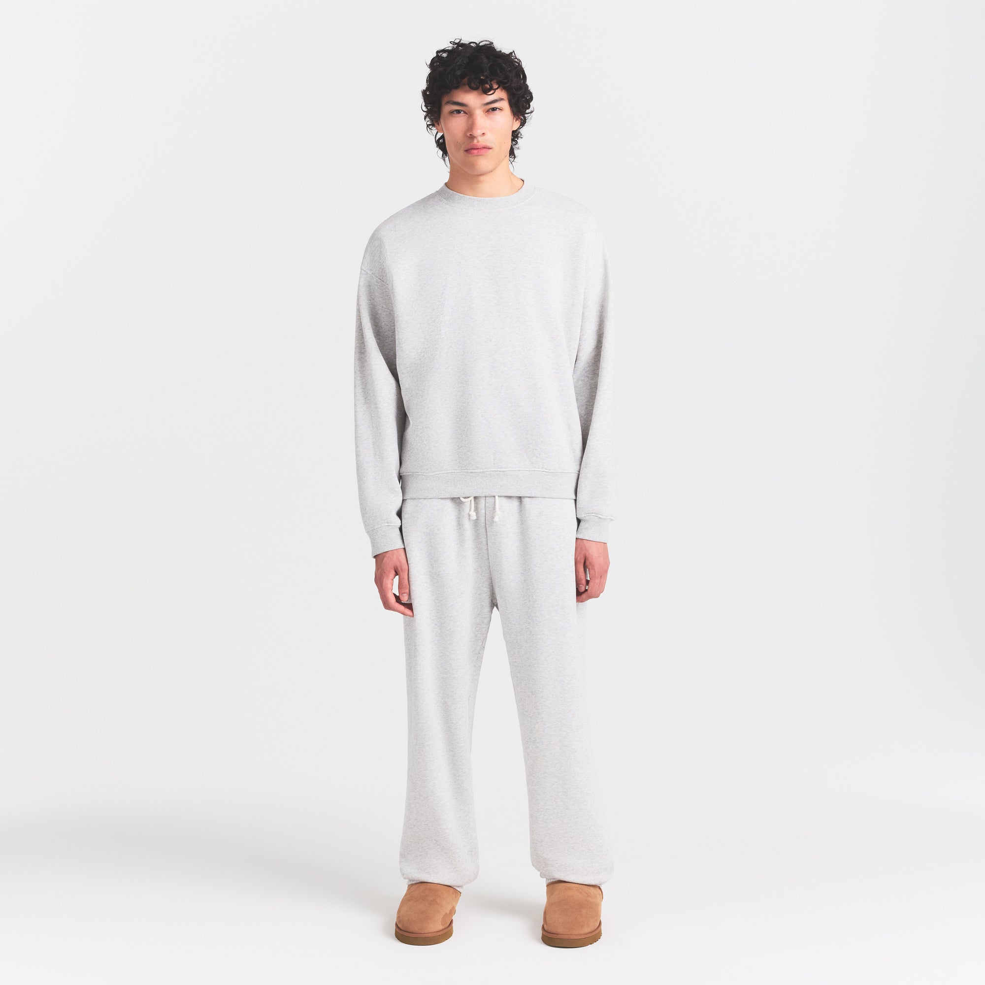 FLEECE LOUNGE MENS RELAXED HIGH CREWNECK | LIGHT HEATHER GREY ON A MODEL FRONT VIEW @ | FOCUS: 0.0, 1.0, 0.9