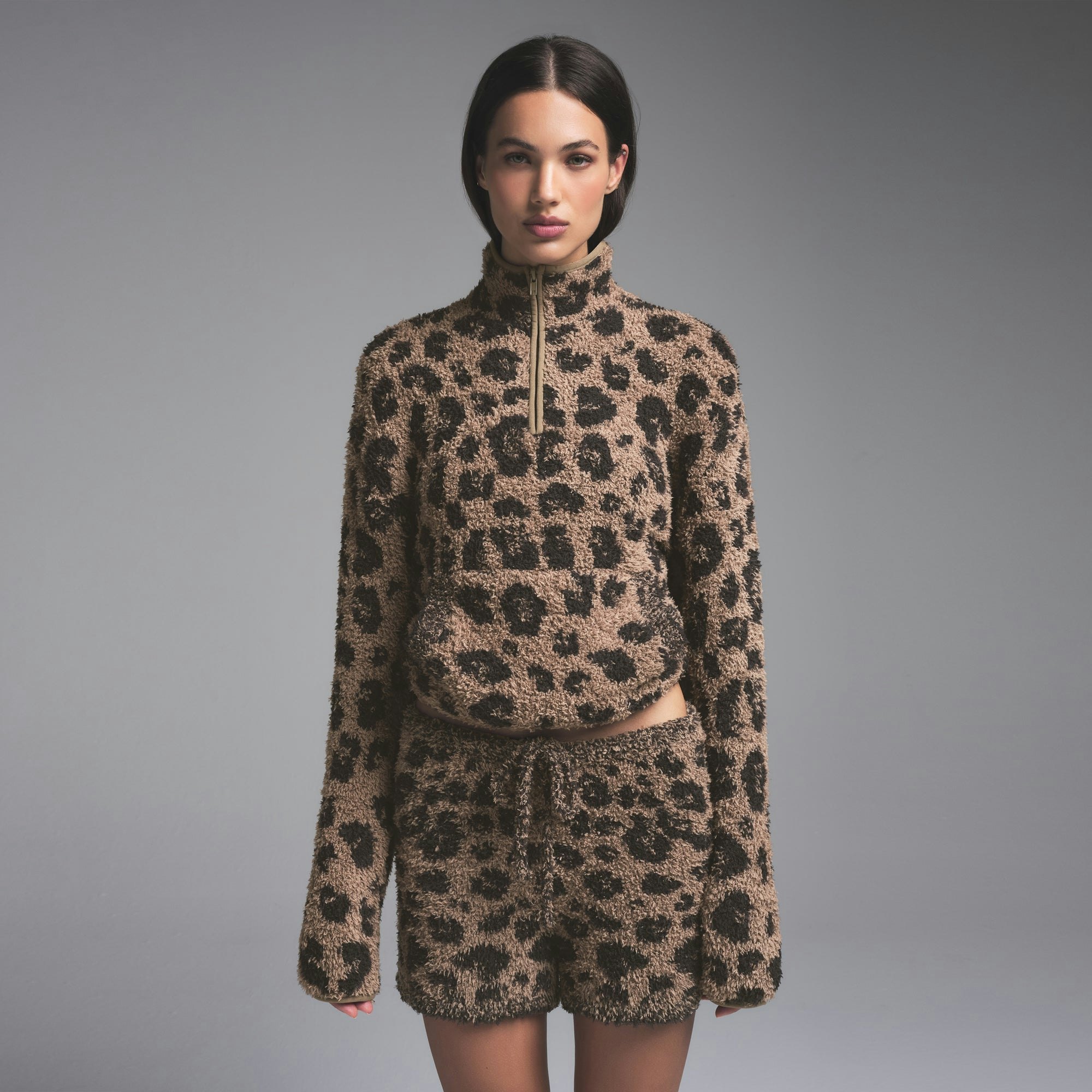 COZY KNIT UNISEX QUARTER ZIP PULLOVER | LEOPARD PRINT ON A MODEL SIDE VIEW