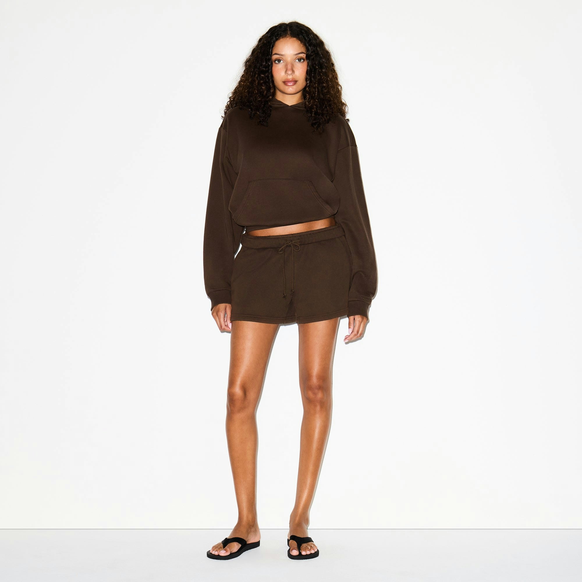 COTTON FLEECE CLASSIC HOODIE | DARK SEPIA ON A MODEL FRONT VIEW @ | FOCUS: 0.0, 1.0, 0.9