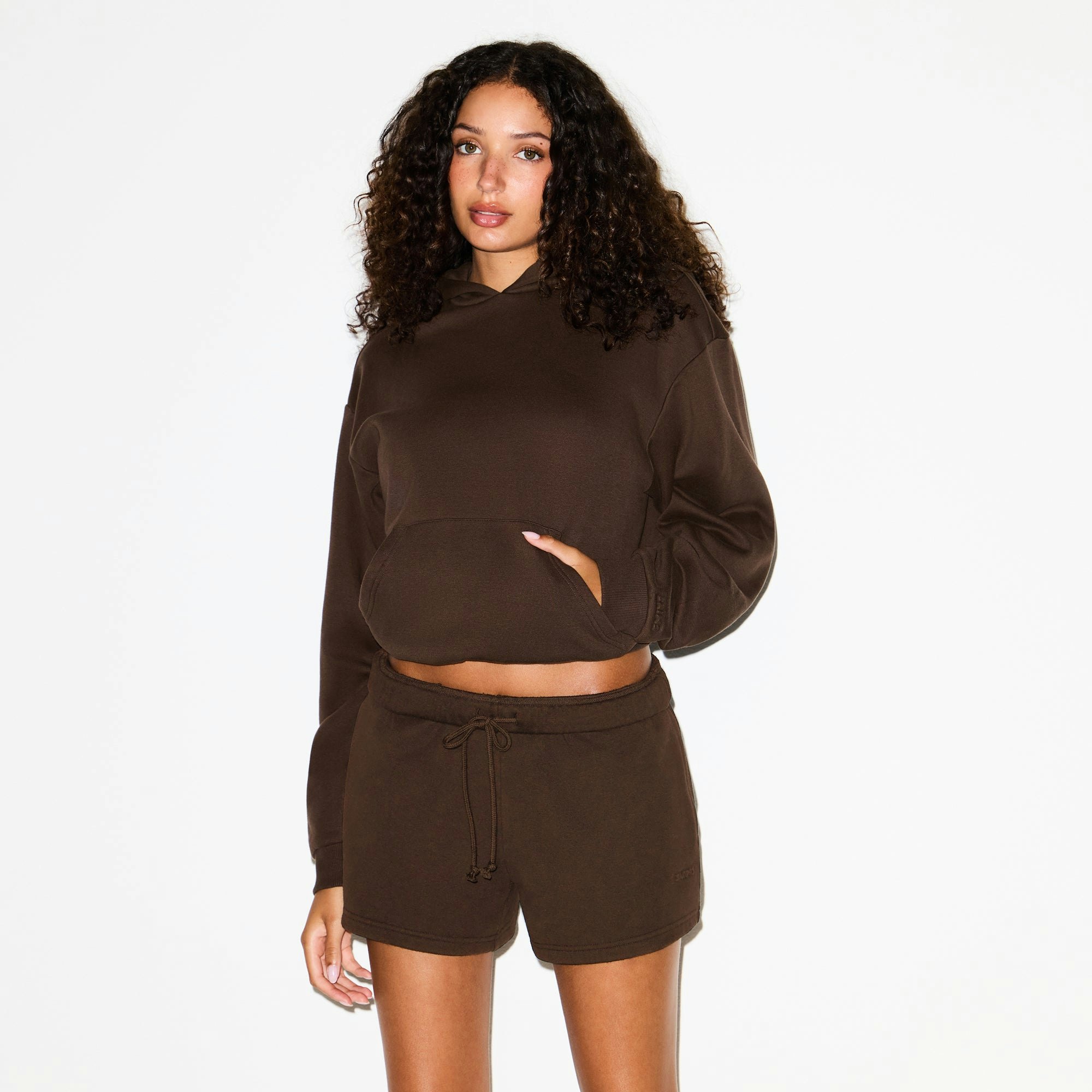 COTTON FLEECE CLASSIC HOODIE | DARK SEPIA ON A MODEL SIDE VIEW @ | FOCUS: 0.0, 1.0, 0.9