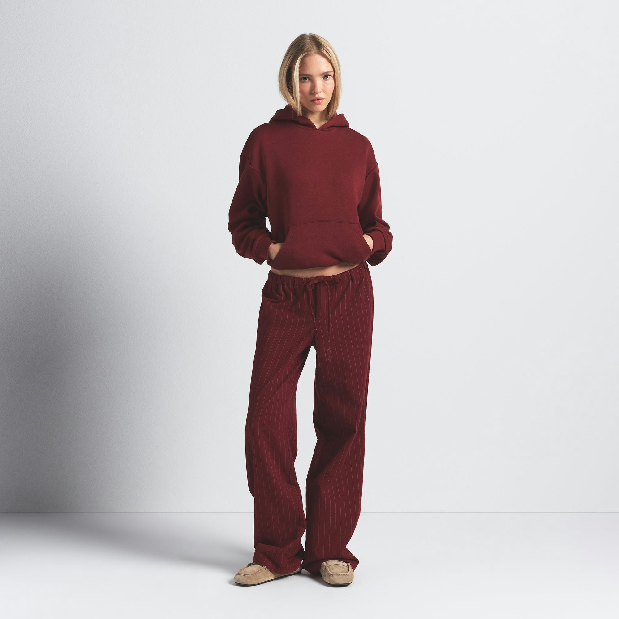 COTTON FLEECE CLASSIC HOODIE | MERLOT ON A MODEL FRONT VIEW @ | FOCUS: 0.0, 1.0, 0.9
