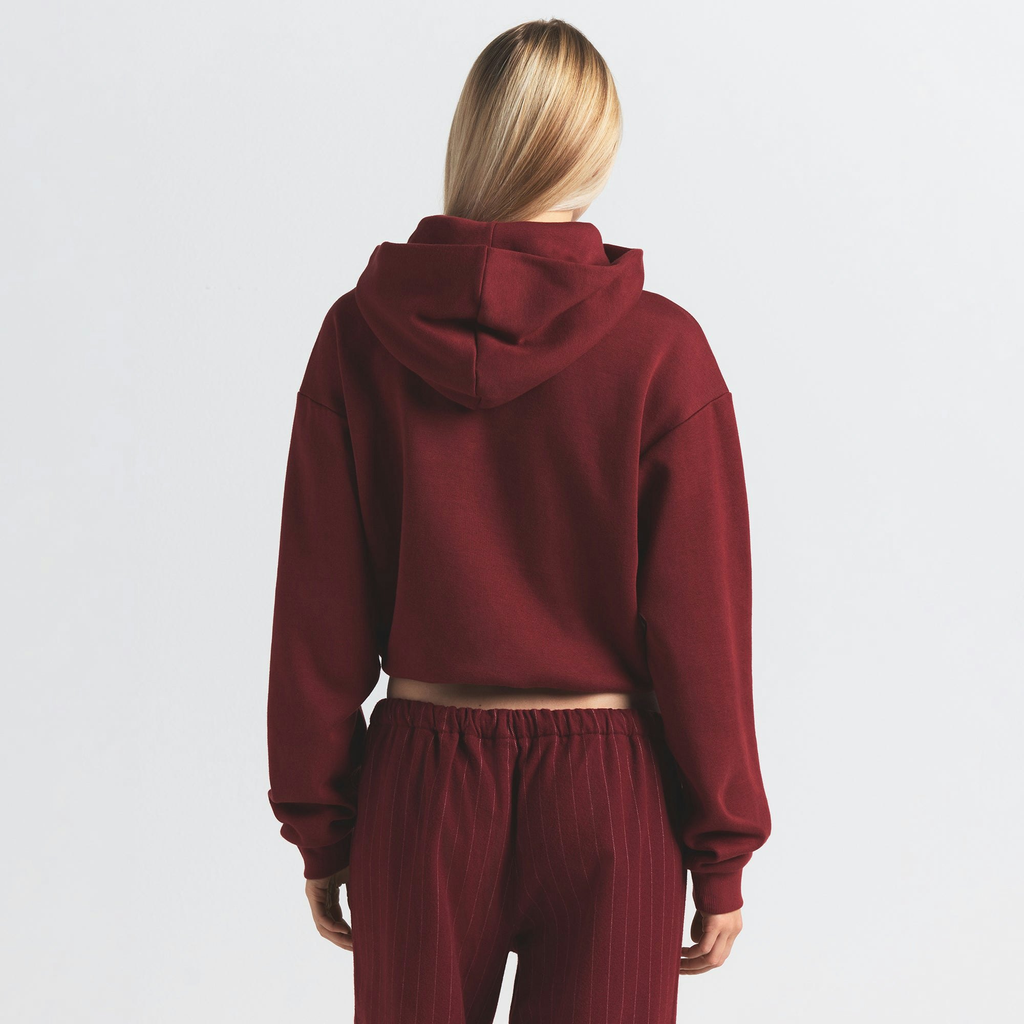 COTTON FLEECE CLASSIC HOODIE | MERLOT ON A MODEL BACK VIEW @ | FOCUS: 0.0, 1.0, 0.9