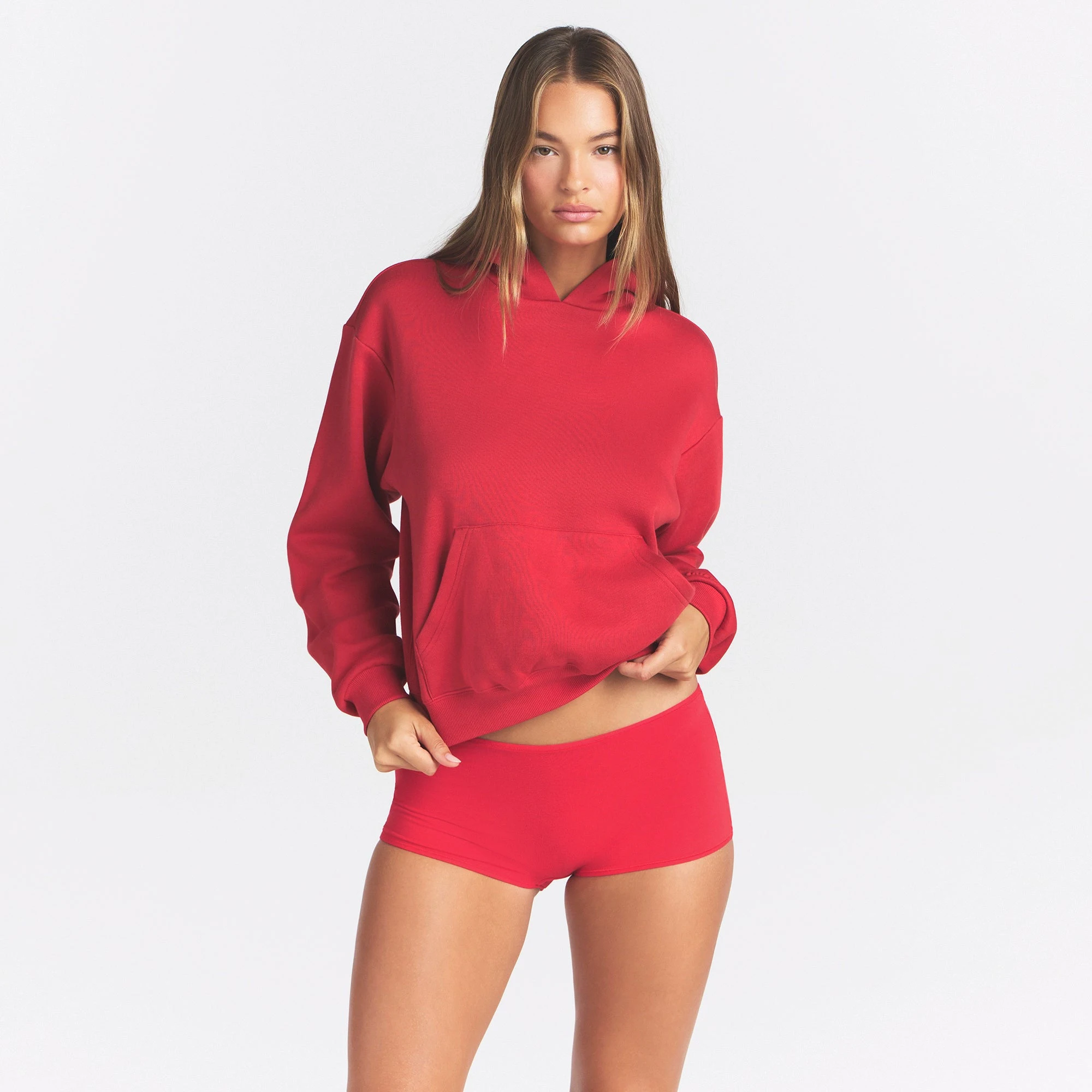COTTON FLEECE CLASSIC HOODIE | WASHED RED ON A MODEL SIDE VIEW @ | FOCUS: 0.0, 1.0, 0.9