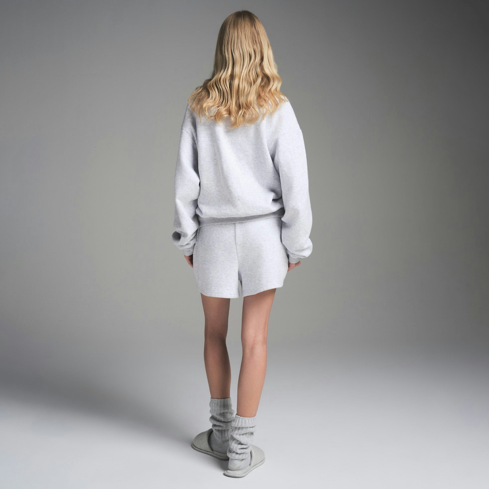 COTTON FLEECE CLASSIC CREWNECK | LIGHT HEATHER GREY ON A MODEL FRONT VIEW | FOCUS: 0.0, 1.0, 0.9