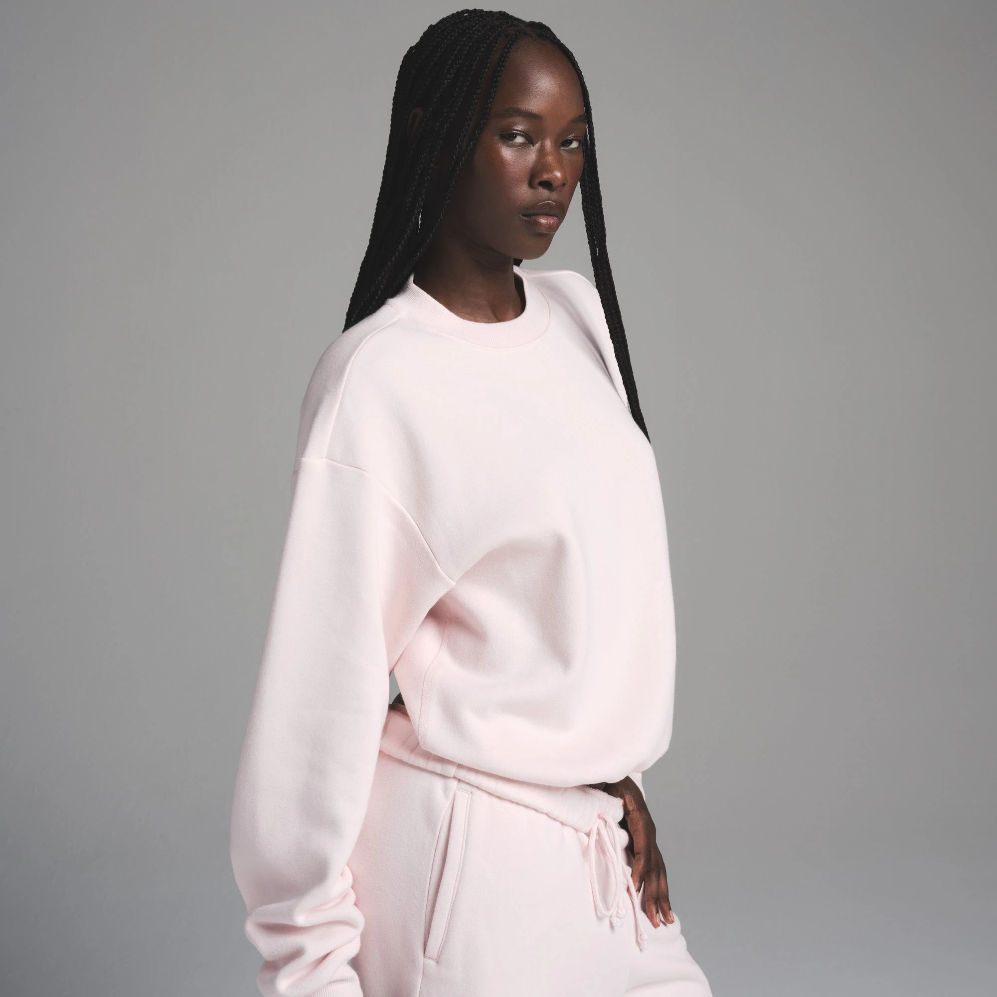COTTON FLEECE CLASSIC CREWNECK | BARELY PINK ON A MODEL FRONT VIEW | FOCUS: 0.0, 1.0, 0.9