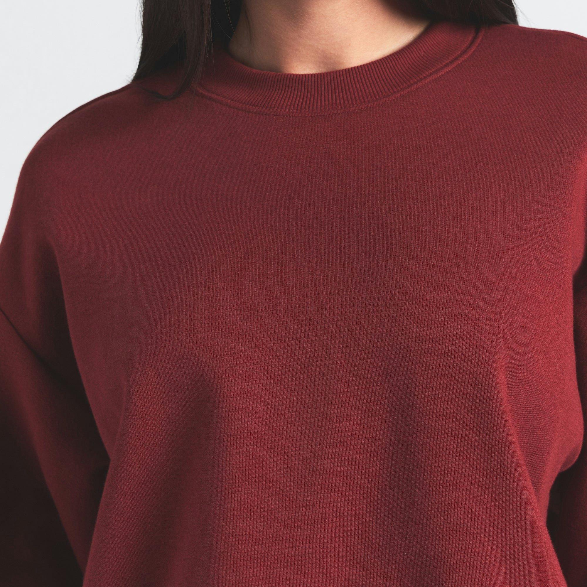 COTTON FLEECE CLASSIC CREWNECK | MERLOT ON A MODEL FRONT VIEW @ | FOCUS: 0.0, 1.0, 0.9
