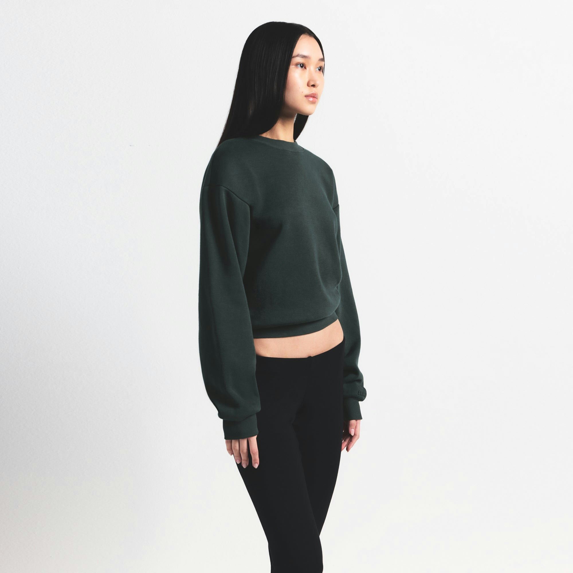 COTTON FLEECE CLASSIC CREWNECK | SPRUCE ON A MODEL SIDE VIEW @ | FOCUS: 0.0, 1.0, 0.9