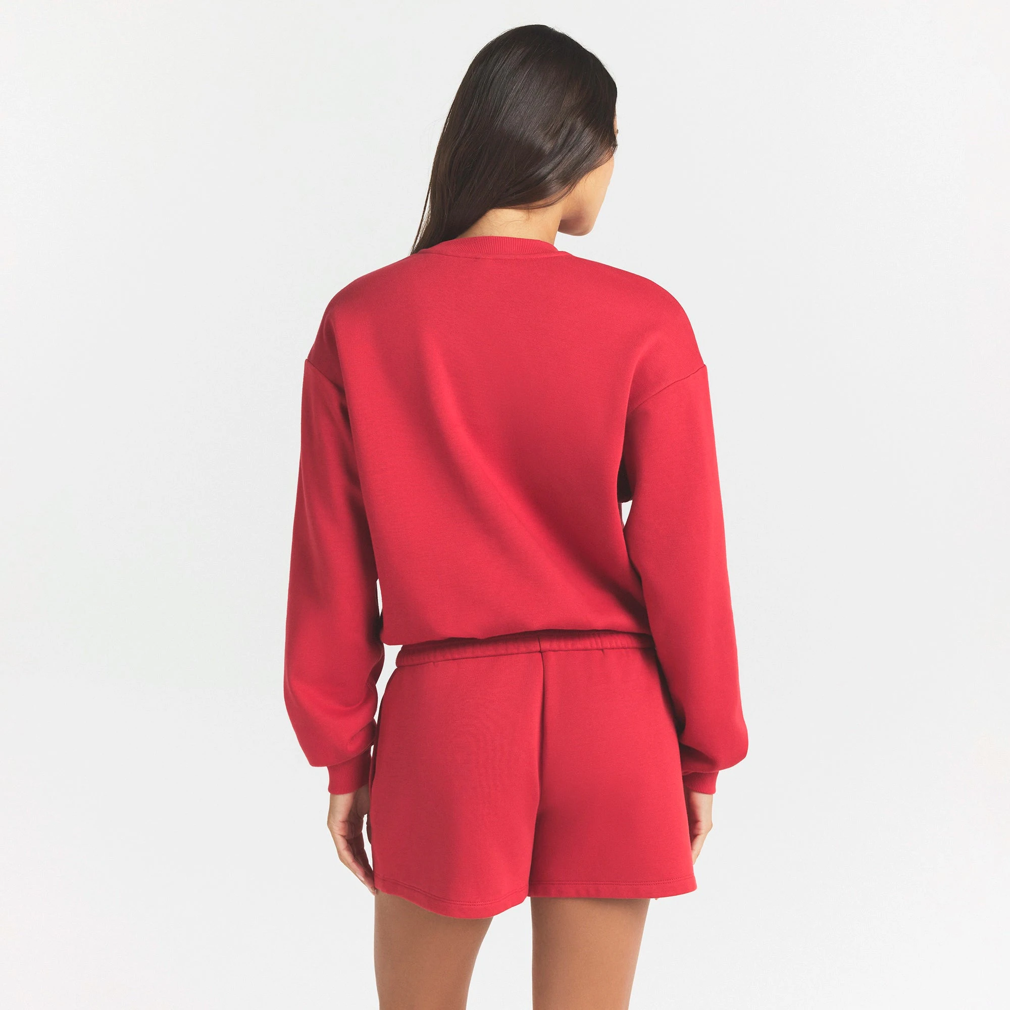 COTTON FLEECE CLASSIC CREWNECK | WASHED RED ON A MODEL SIDE VIEW @ | FOCUS: 0.0, 1.0, 0.9