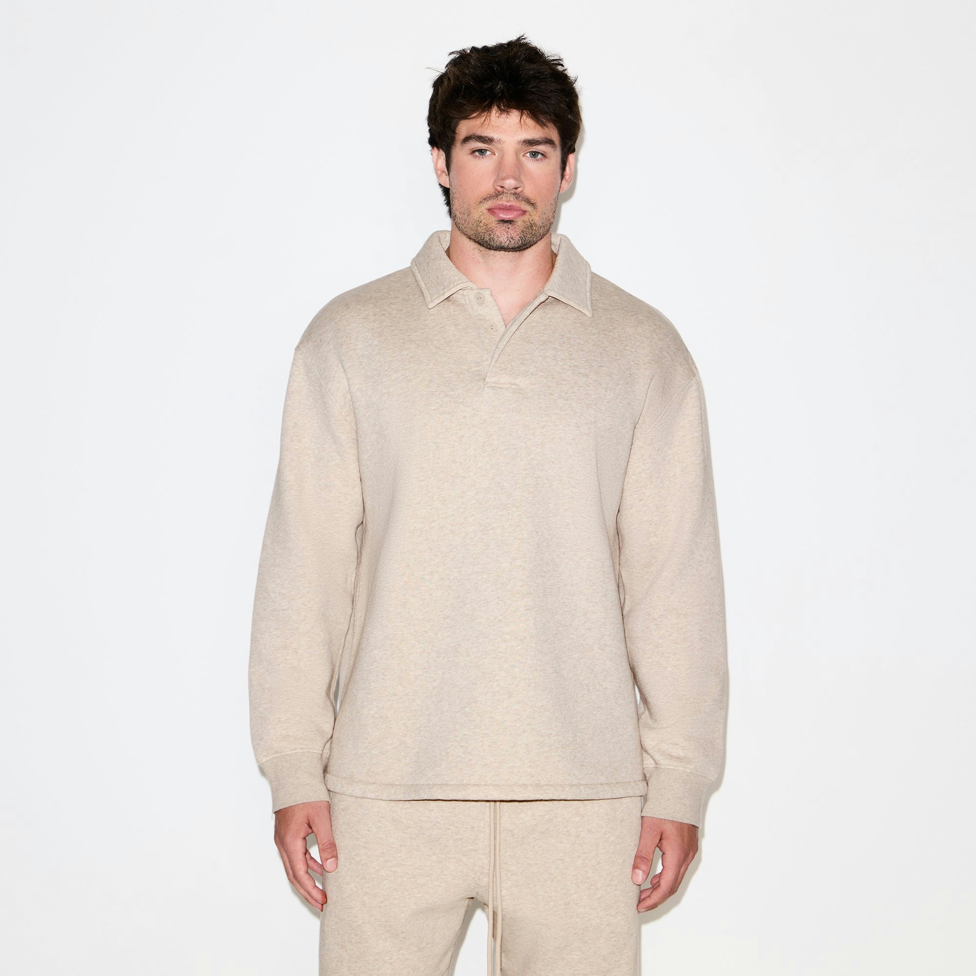FLEECE LOUNGE MENS RELAXED POLO | DESERT HEATHER GREY ON A MODEL SIDE VIEW @ | FOCUS: 0.0, 1.0, 0.9