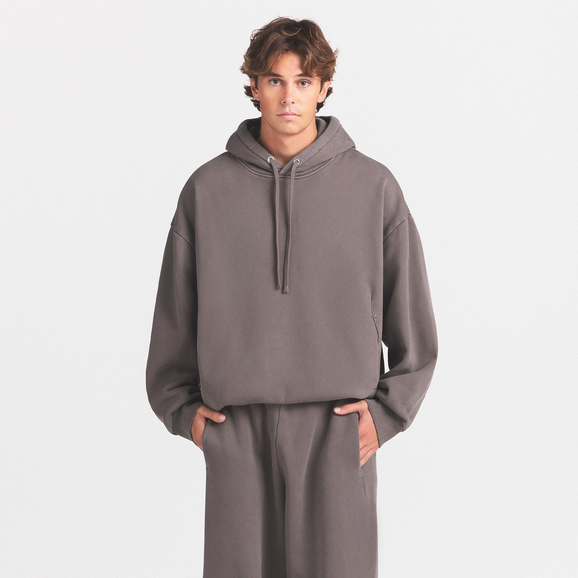 HEAVYWEIGHT FLEECE MENS HOODIE | STERLING ON A MODEL SIDE VIEW @ | FOCUS: 0.0, 1.0, 0.9
