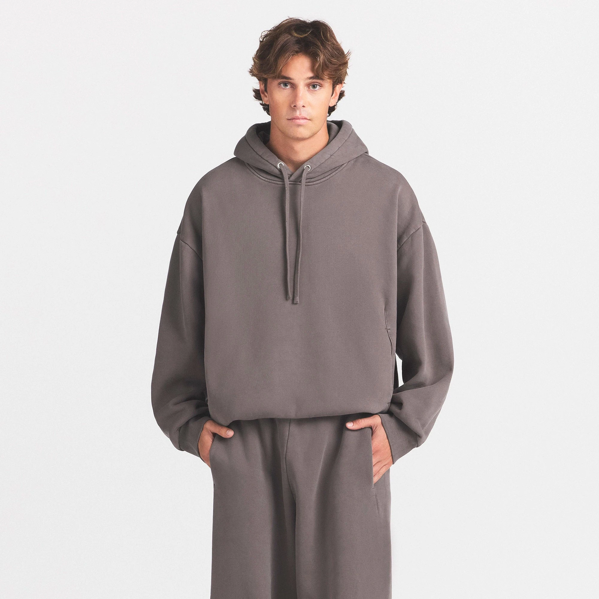 HEAVYWEIGHT FLEECE MENS HOODIE | STERLING ON A MODEL SIDE VIEW @ | FOCUS: 0.0, 1.0, 0.9