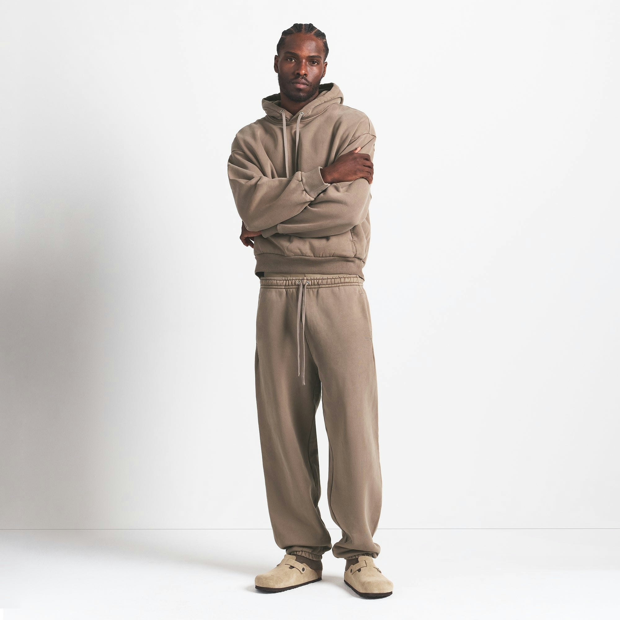 HEAVYWEIGHT FLEECE MENS HOODIE | TRUFFLE ON A MODEL FRONT VIEW @ | FOCUS: 0.0, 1.0, 0.9