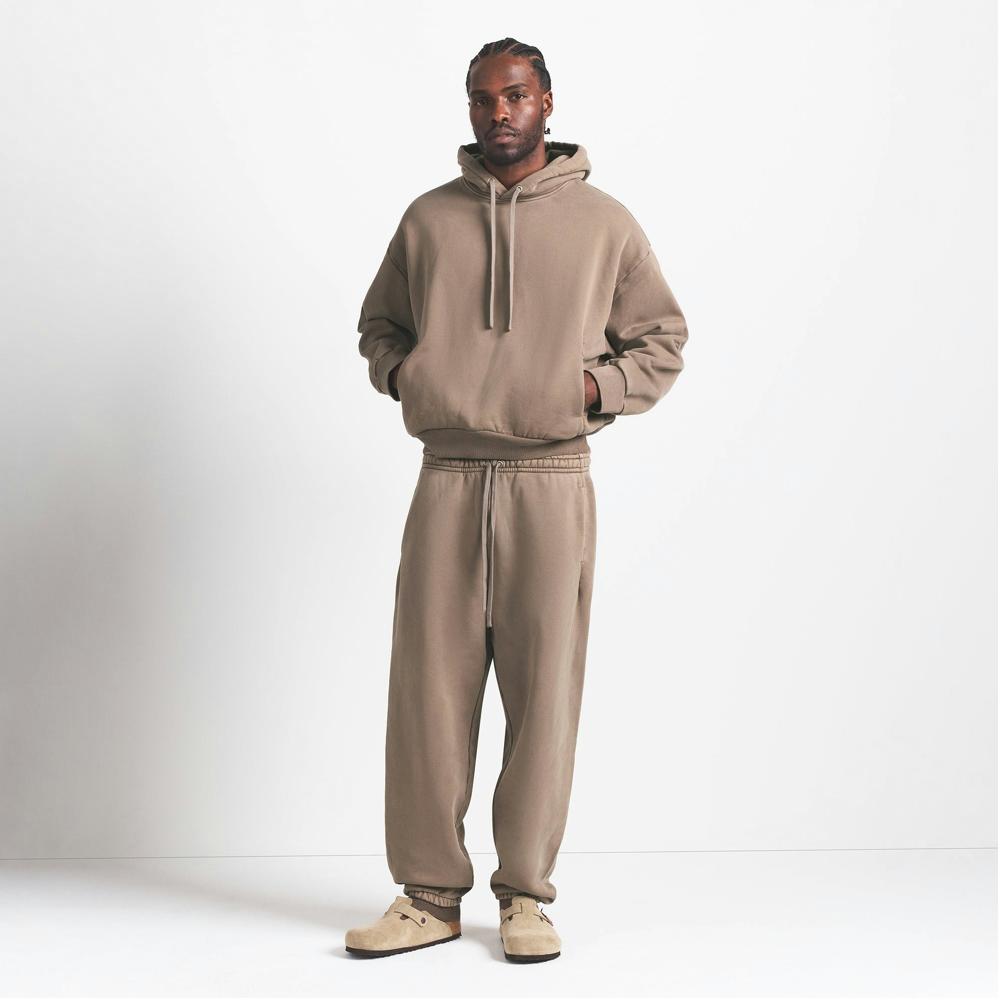 HEAVYWEIGHT FLEECE MENS HOODIE | TRUFFLE ON A MODEL FRONT VIEW @ | FOCUS: 0.0, 1.0, 0.9