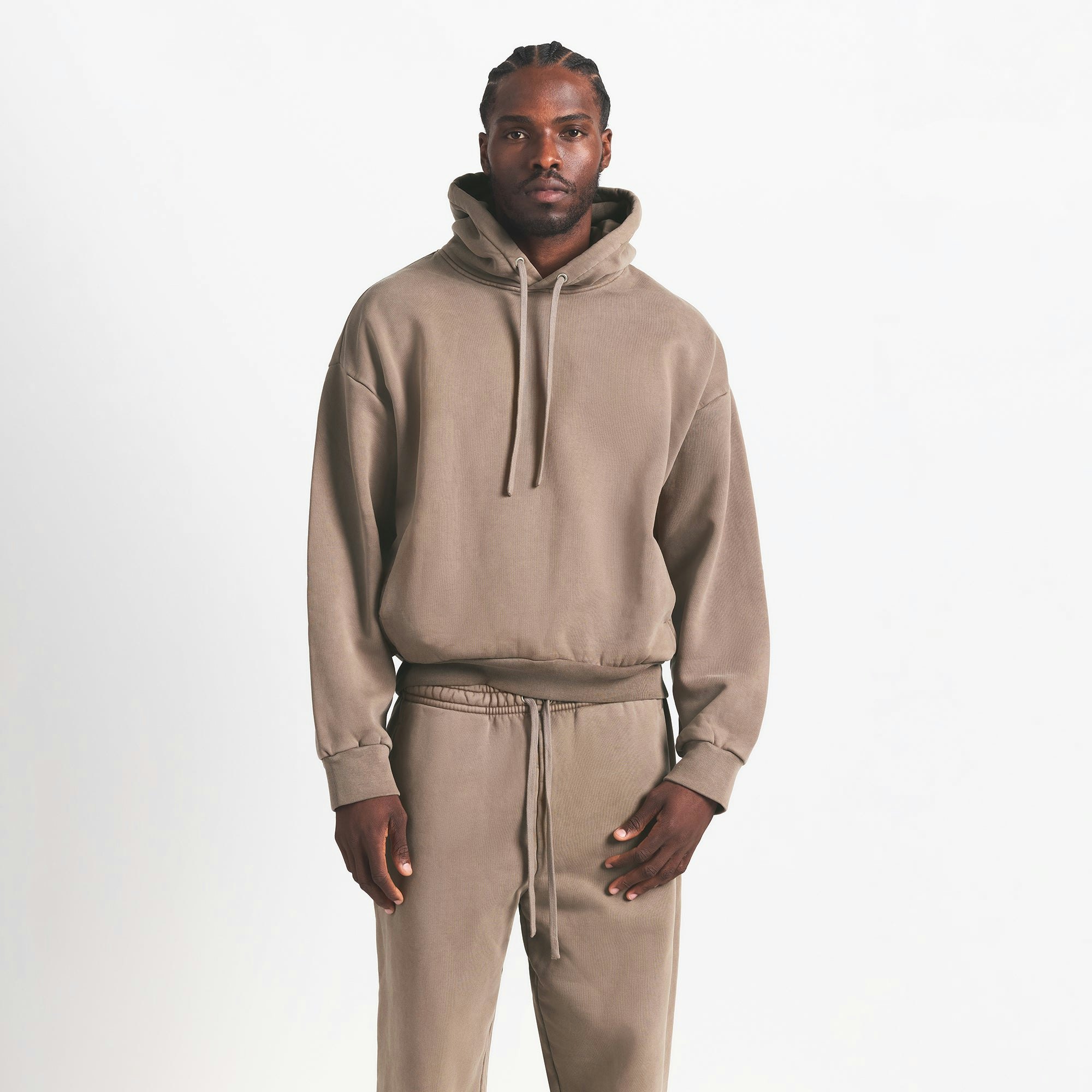 HEAVYWEIGHT FLEECE MENS HOODIE | TRUFFLE ON A MODEL FRONT VIEW @ | FOCUS: 0.0, 1.0, 0.9