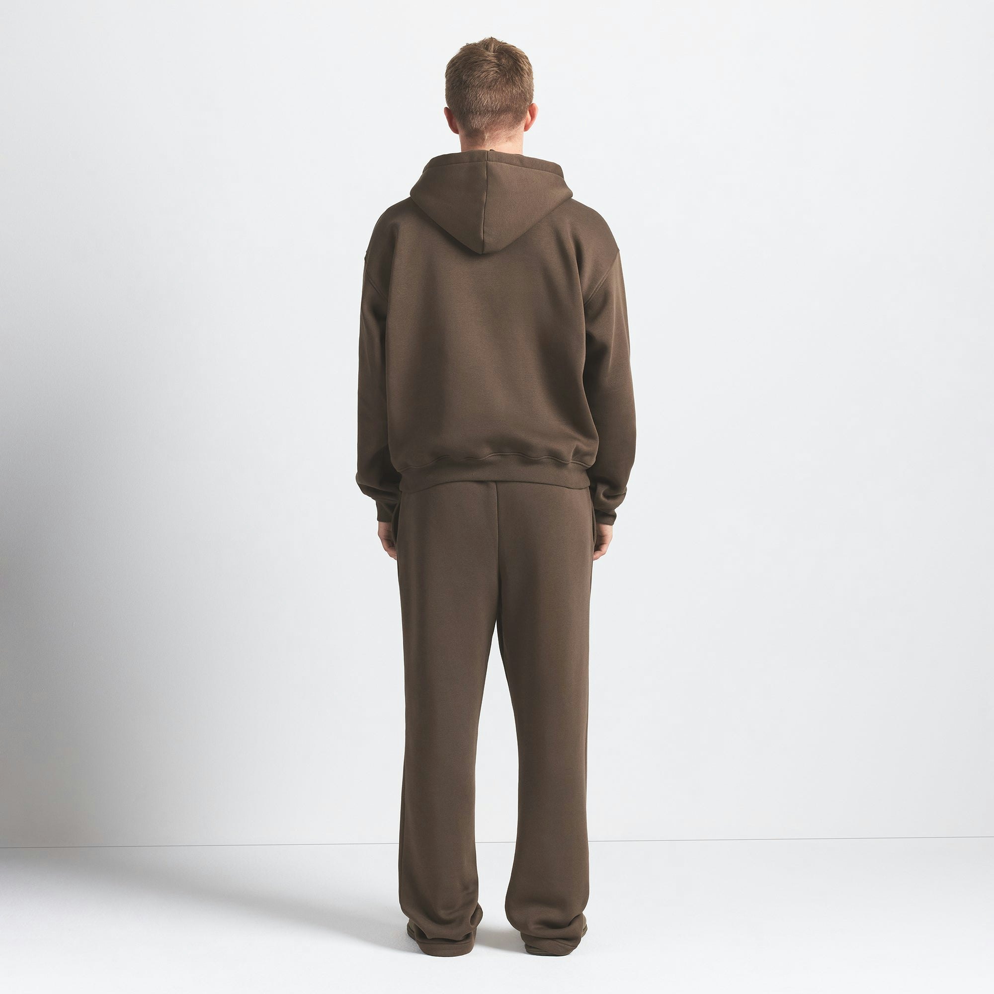 FLEECE LOUNGE MENS RELAXED HOODIE | DRIFTWOOD ON A MODEL BACK VIEW @ | FOCUS: 0.0, 1.0, 0.9