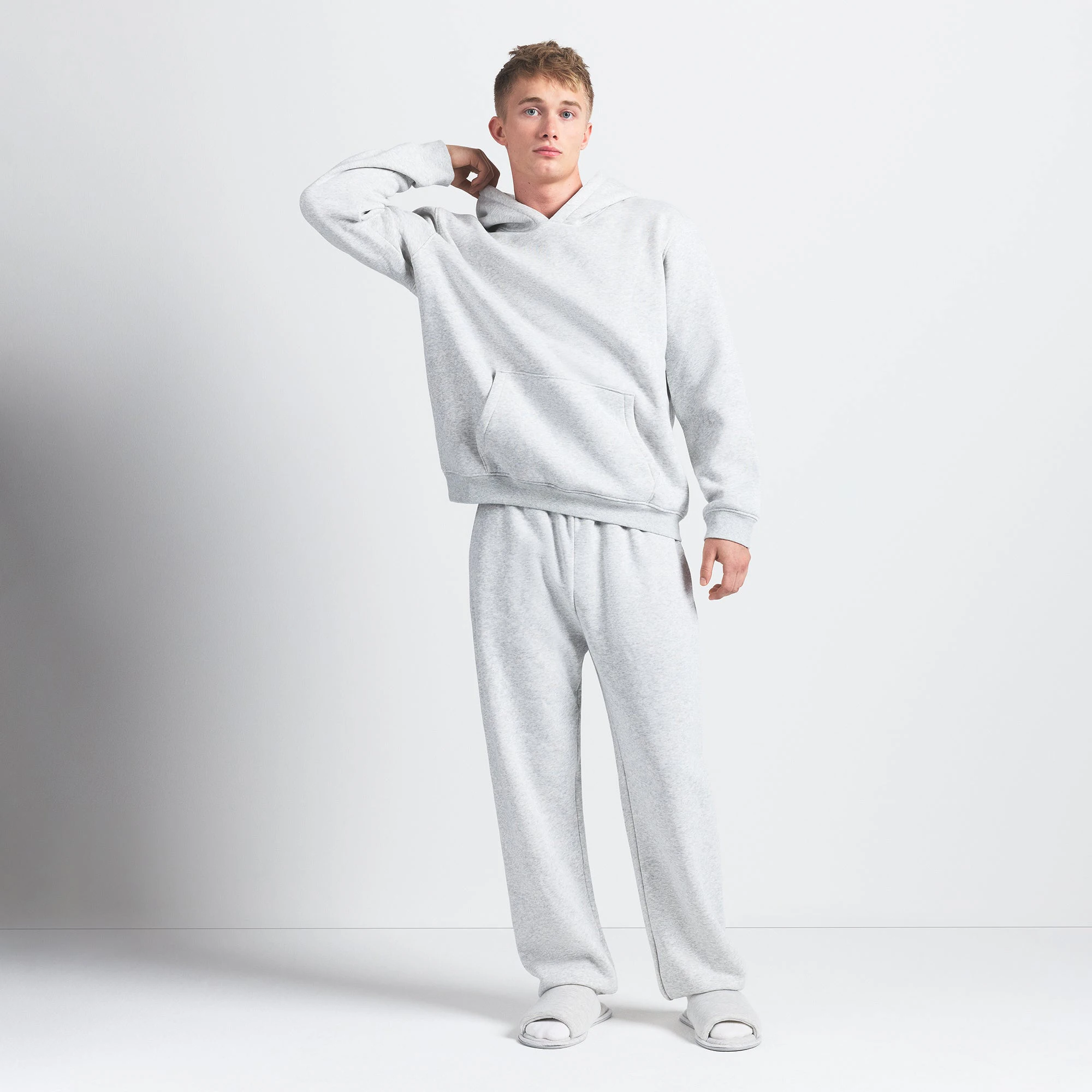 FLEECE LOUNGE MENS RELAXED HOODIE | LIGHT HEATHER GREY ON A MODEL FRONT VIEW @ | FOCUS: 0.0, 1.0, 0.9
