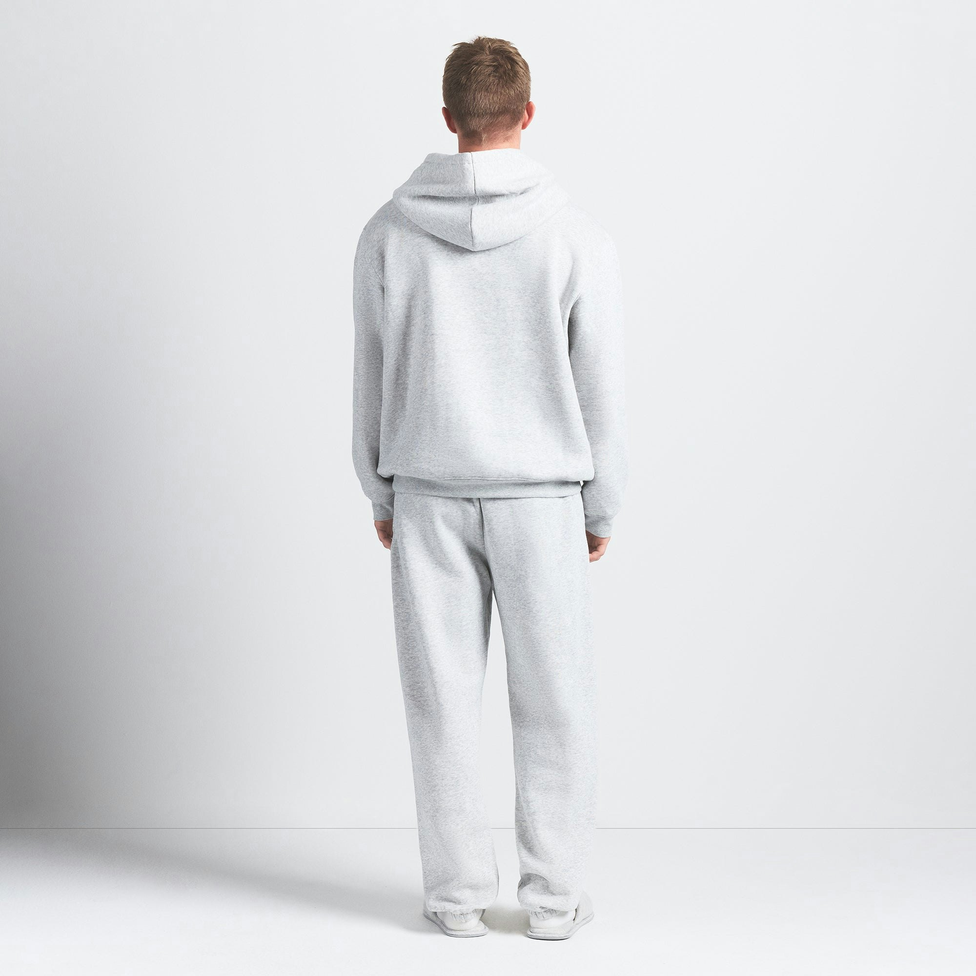 FLEECE LOUNGE MENS RELAXED HOODIE | LIGHT HEATHER GREY ON A MODEL BACK VIEW @ | FOCUS: 0.0, 1.0, 0.9