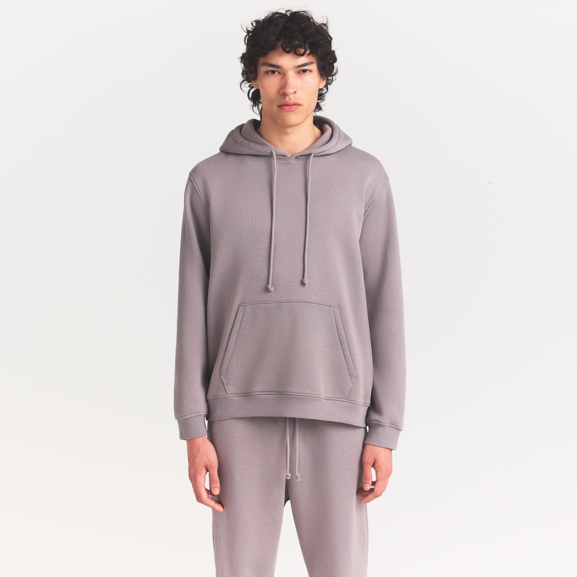 FLEECE LOUNGE MENS RELAXED HOODIE | SHADOW ON A MODEL SIDE VIEW @ | FOCUS: 0.0, 1.0, 0.9