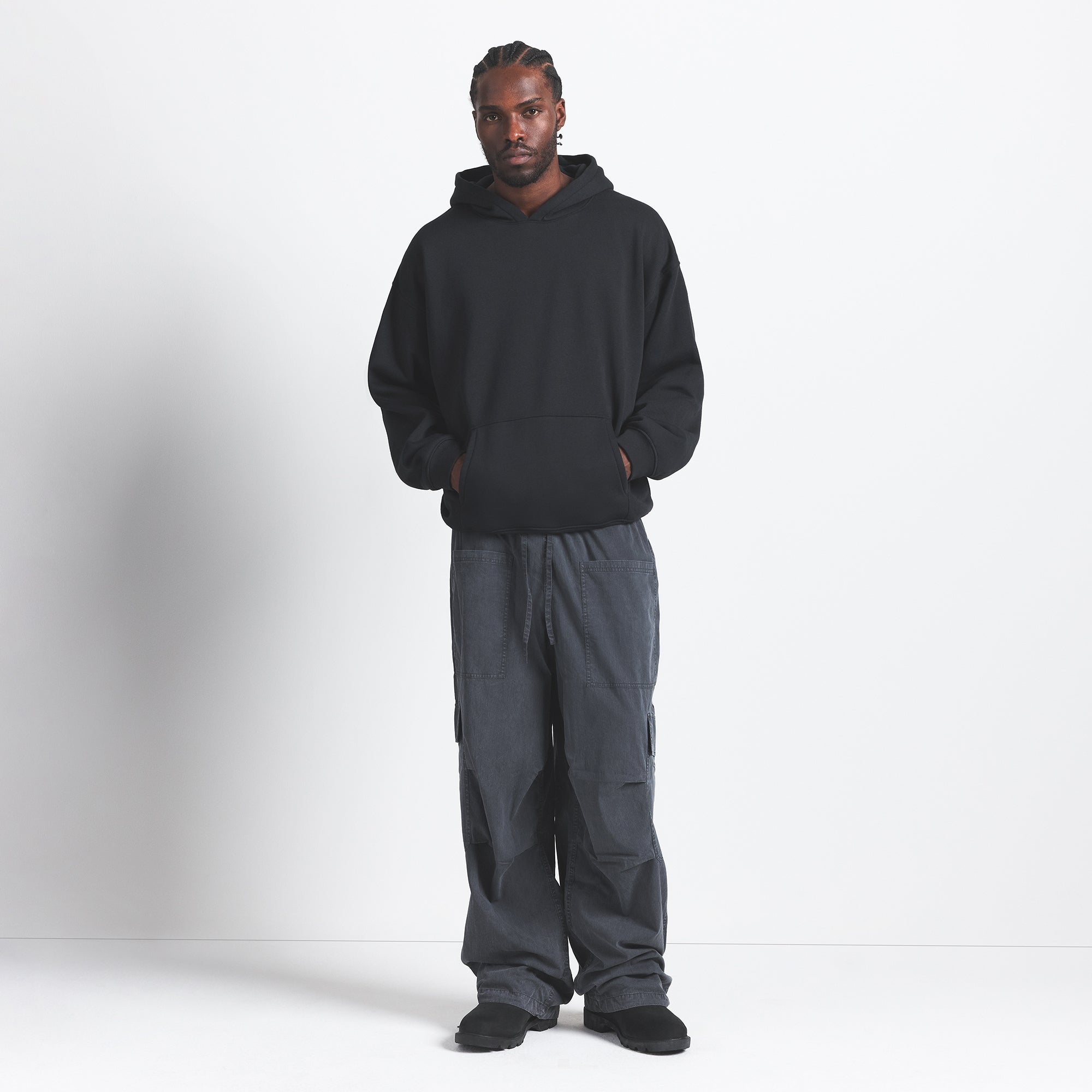 FLEECE LOUNGE MENS RELAXED HOODIE | WASHED ONYX ON A MODEL FRONT VIEW @ | FOCUS: 0.0, 1.0, 0.9