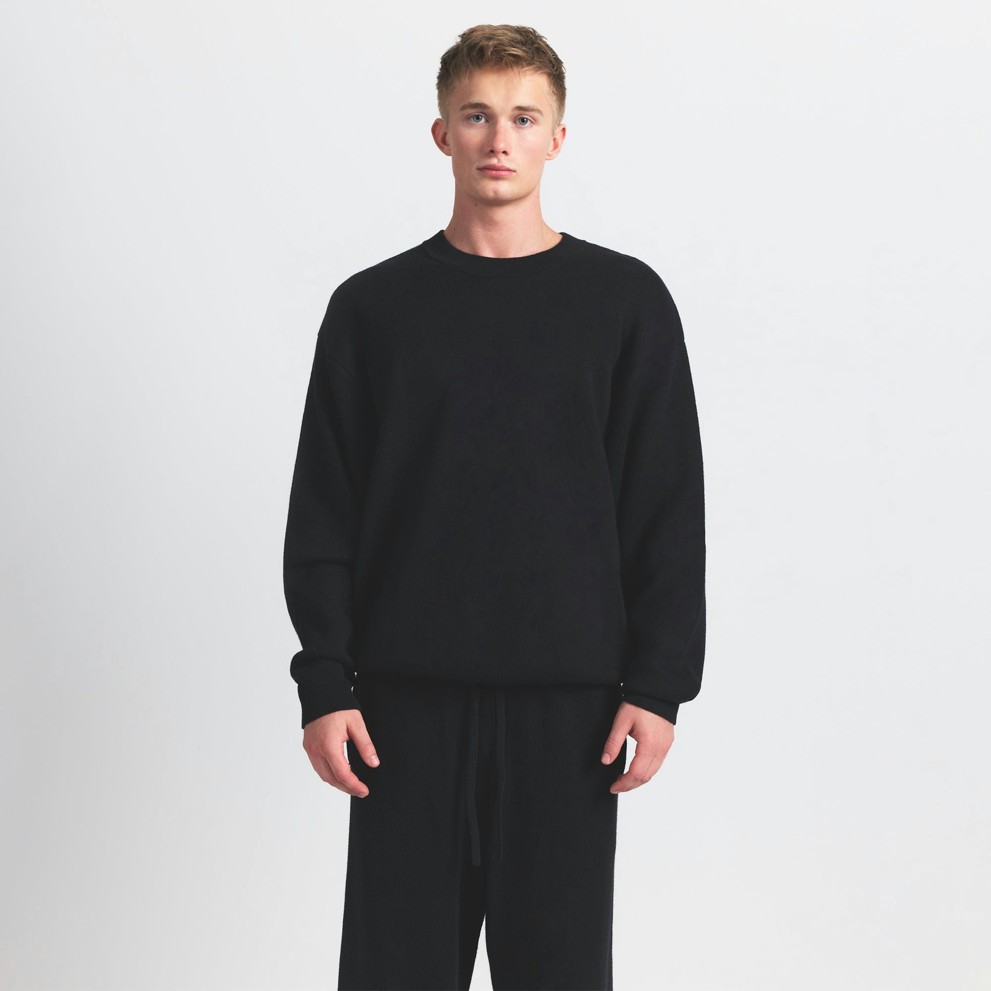 COTTON KNIT MENS SWEATER | OBSIDIAN ON A MODEL SIDE VIEW @ | FOCUS: 0.0, 1.0, 0.9