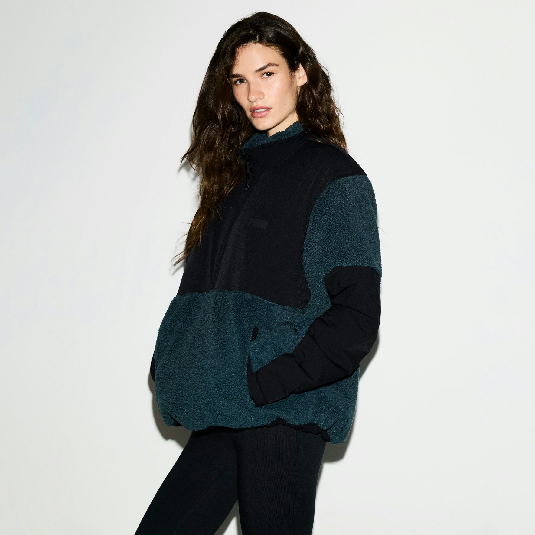 TEDDY OVERSIZED HALF ZIP UP PULLOVER | DARK TEAL ON A MODEL SIDE VIEW @ | FOCUS: 0.0, 1.0, 0.9