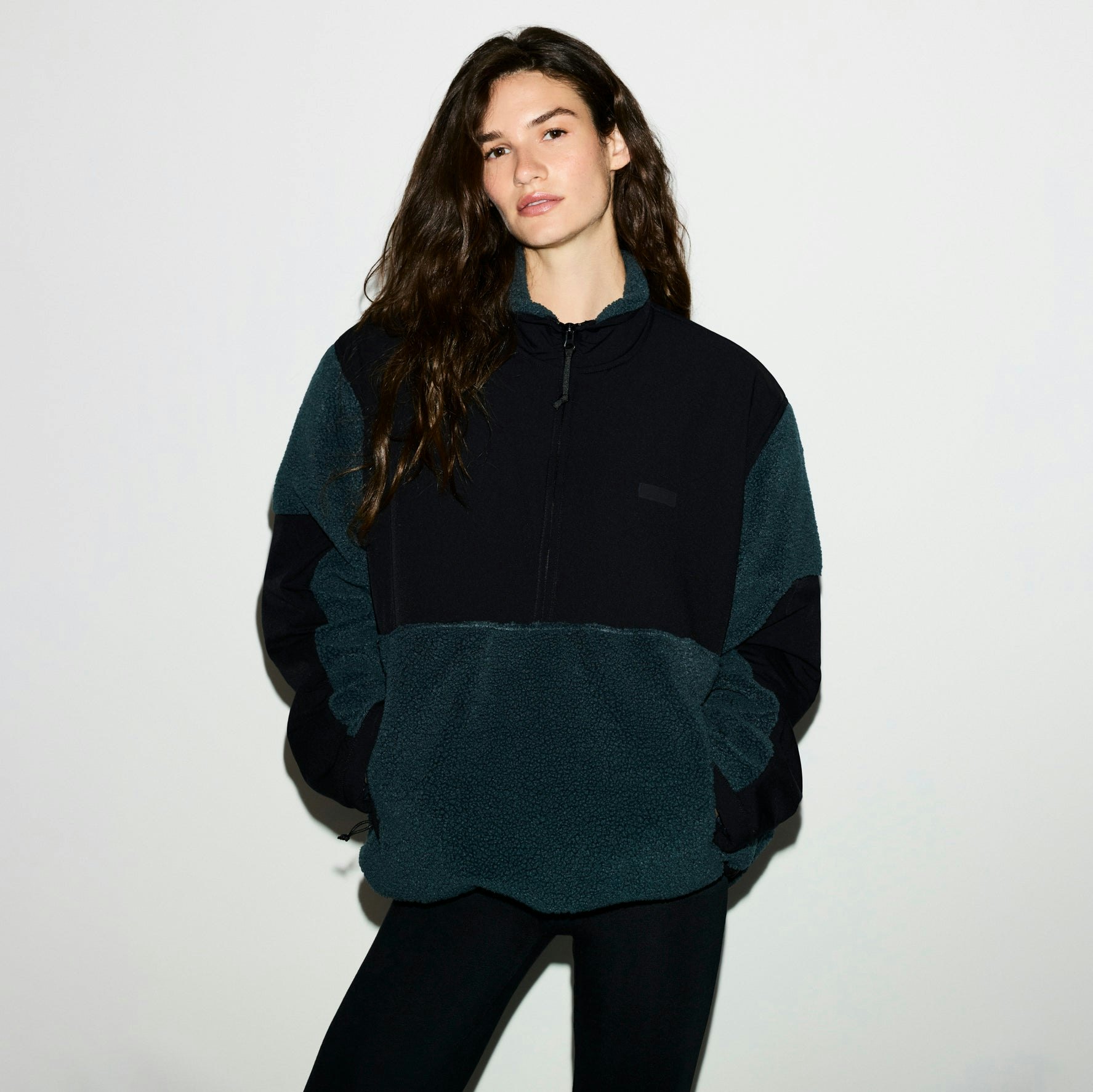 TEDDY OVERSIZED HALF ZIP UP PULLOVER | DARK TEAL ON A MODEL SIDE VIEW @ | FOCUS: 0.0, 1.0, 0.9