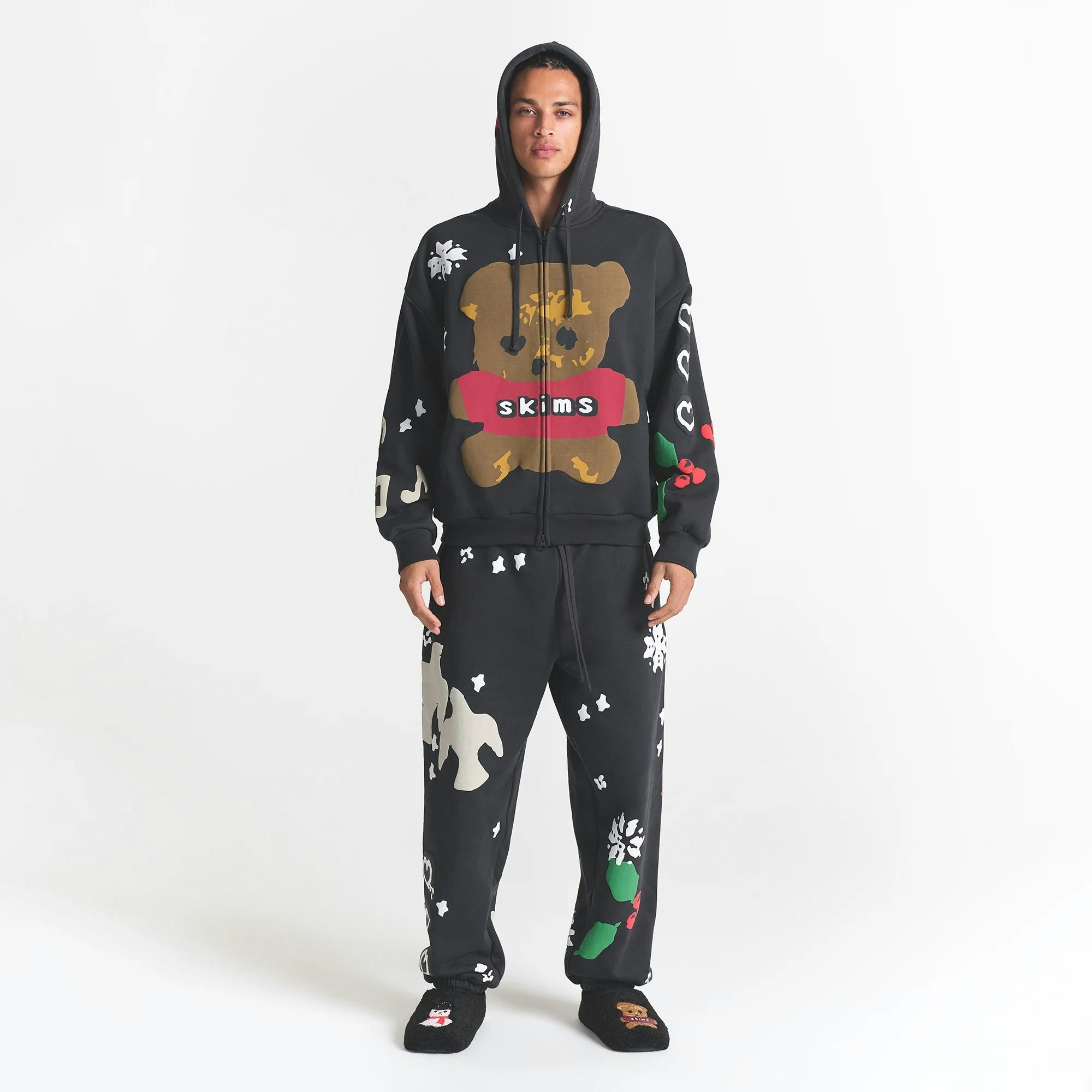CACTUS PLANT FLEA MARKET X SKIMS HEAVYWEIGHT FLEECE MENS RELAXED ZIP UP HOODIE | ONYX TEDDY BEAR PRINT ON A MODEL FRONT VIEW @ | FOCUS: 0.0, 1.0, 0.9
