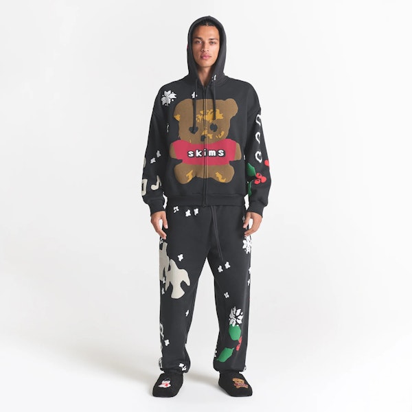 CACTUS PLANT FLEA MARKET X SKIMS HEAVYWEIGHT FLEECE MENS RELAXED ZIP UP HOODIE | ONYX TEDDY BEAR PRINT ON A MODEL FRONT VIEW @ | FOCUS: 0.0, 1.0, 0.9