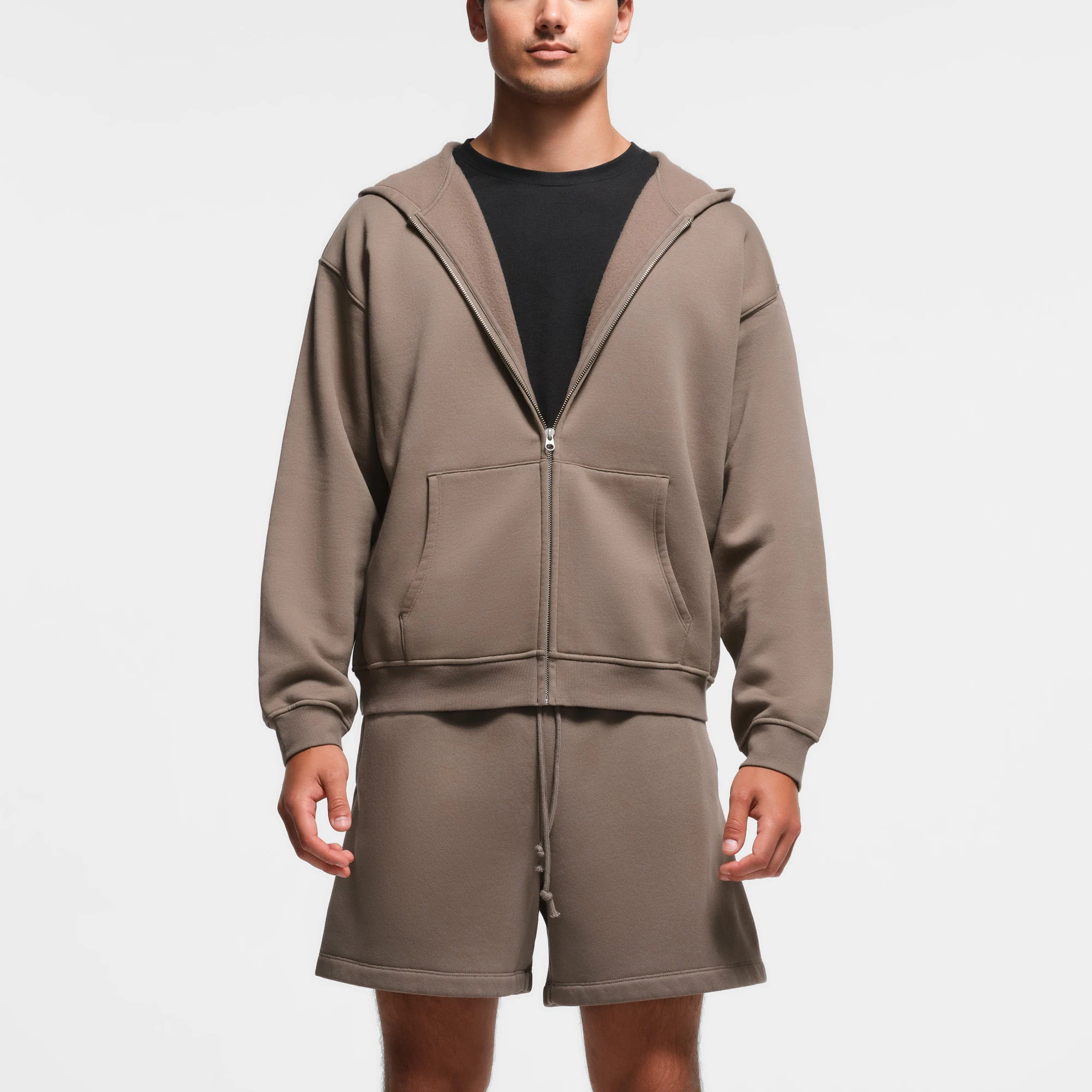 FLEECE LOUNGE MENS RELAXED ZIP UP HOODIE | TRUFFLE ON A MODEL FRONT VIEW