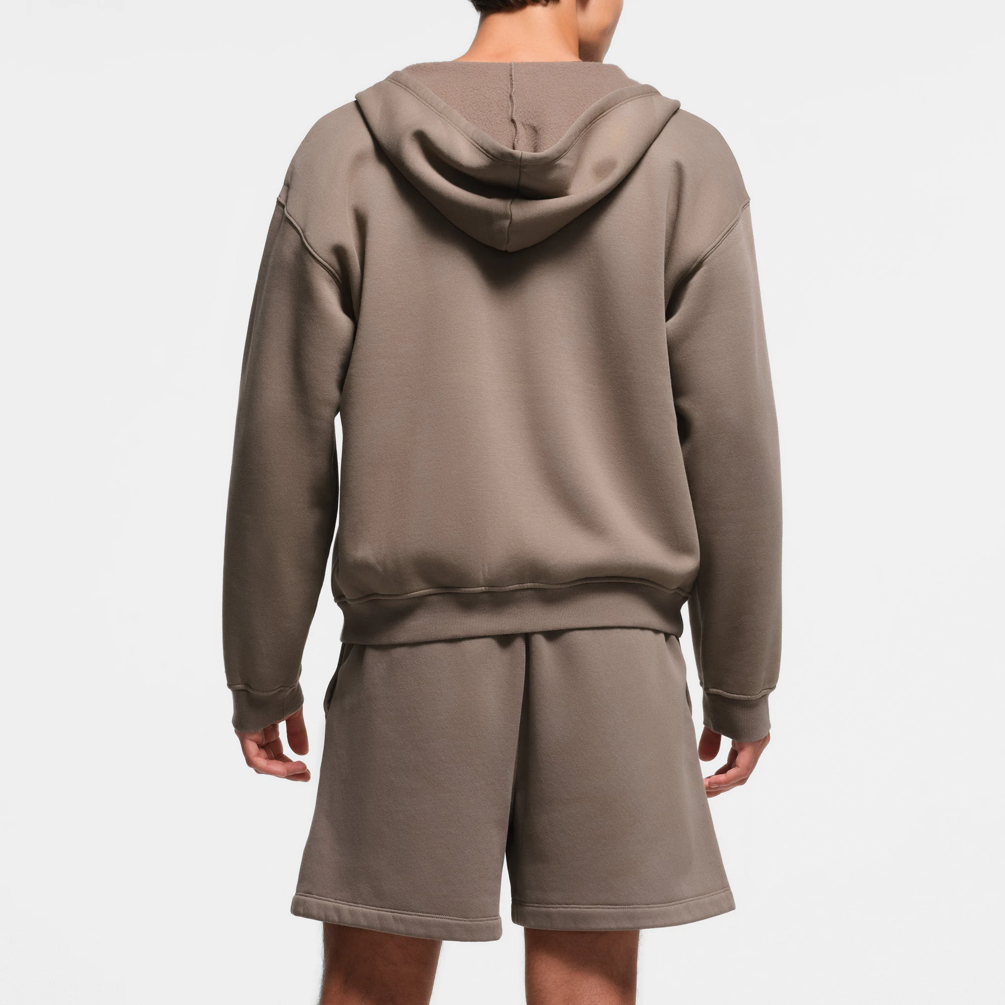 FLEECE LOUNGE MENS RELAXED ZIP UP HOODIE | TRUFFLE ON A MODEL BACK VIEW