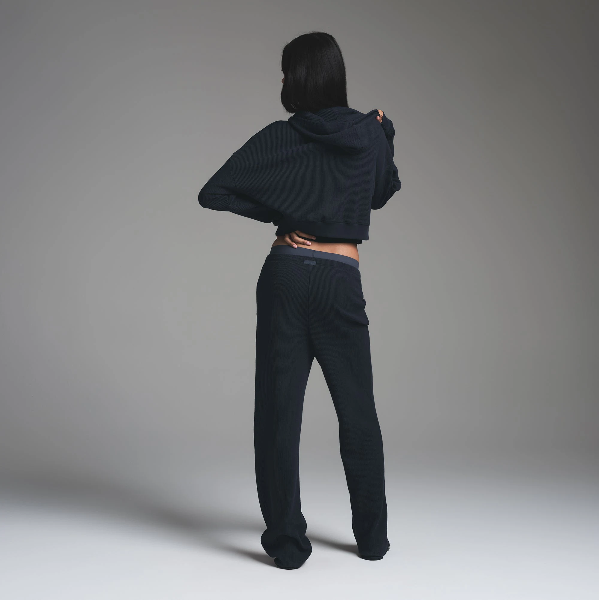 HEAVY WAFFLE CROPPED ZIP UP HOODIE | NAVY ON A MODEL BACK VIEW