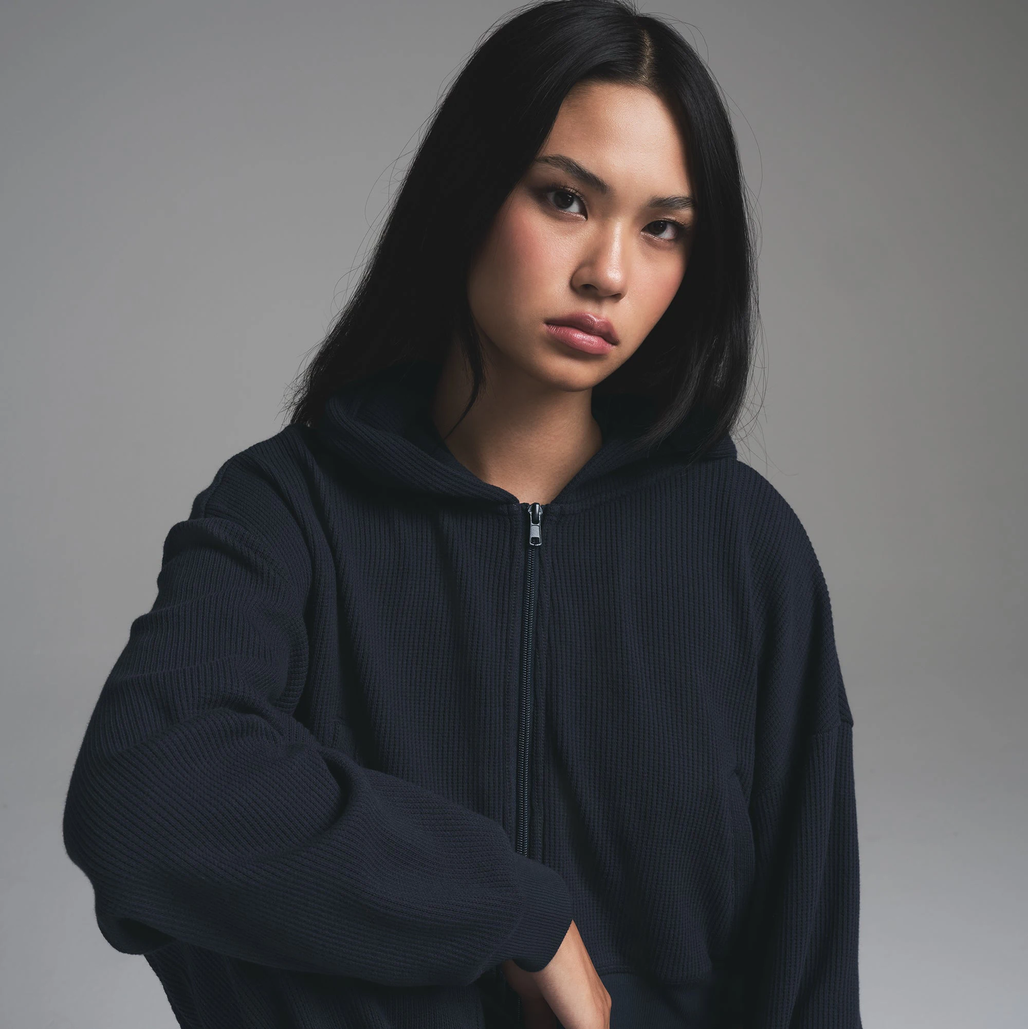 HEAVY WAFFLE CROPPED ZIP UP HOODIE | NAVY ON A MODEL FRONT VIEW