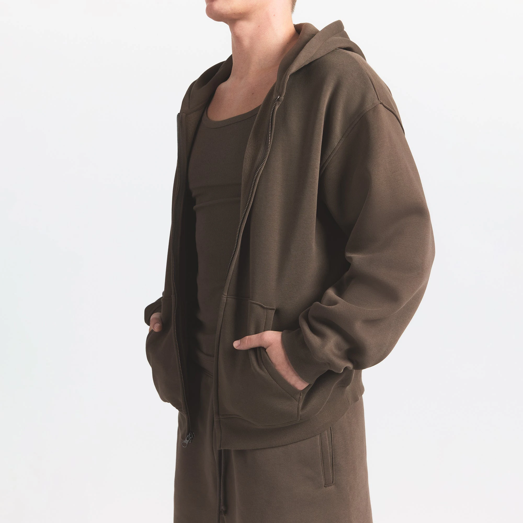 FLEECE LOUNGE MENS RELAXED ZIP UP HOODIE | DRIFTWOOD ON A MODEL SIDE VIEW @ | FOCUS: 0.0, 1.0, 0.9
