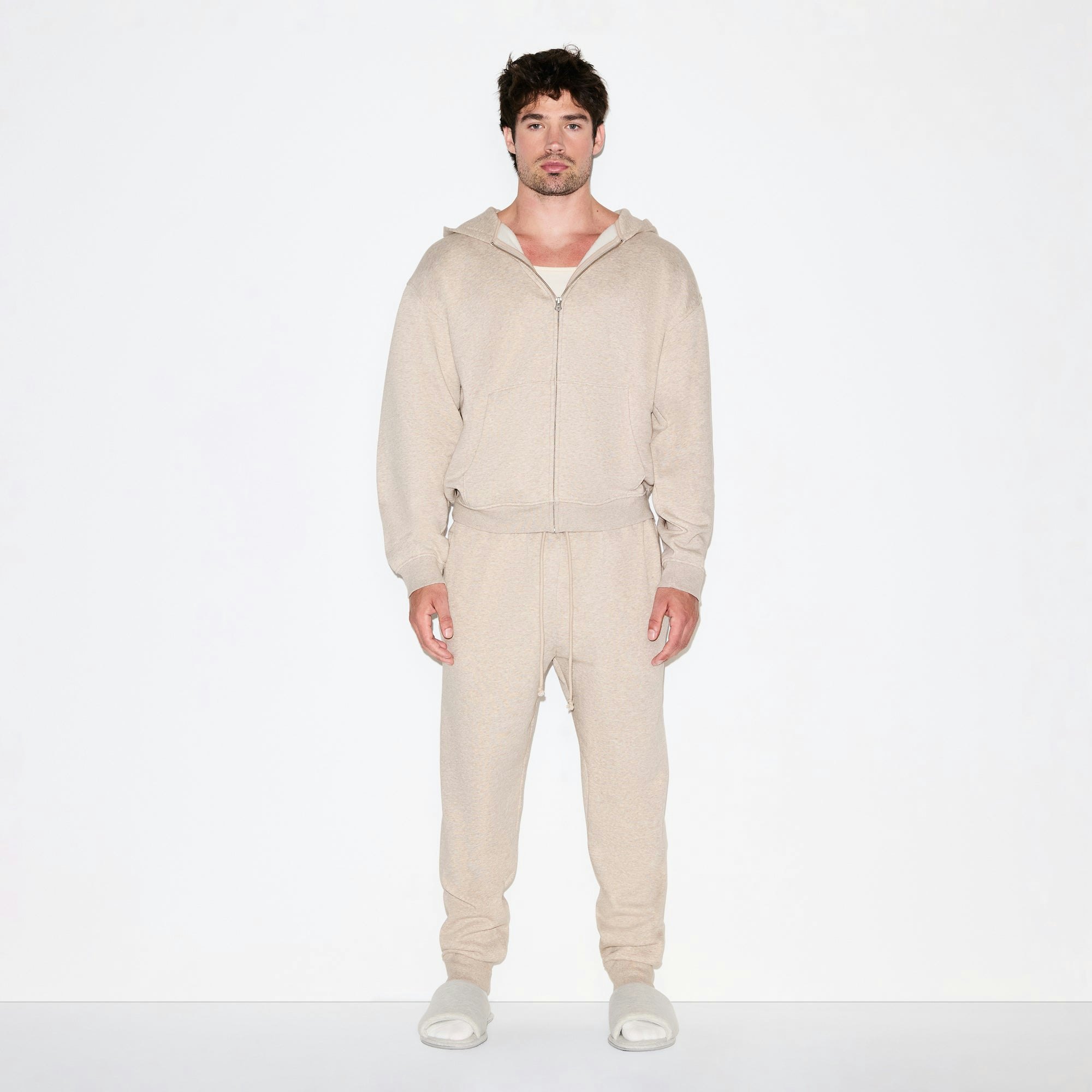 FLEECE LOUNGE MENS RELAXED ZIP UP HOODIE | DESERT HEATHER ON A MODEL FRONT VIEW @ | FOCUS: 0.0, 1.0, 0.9