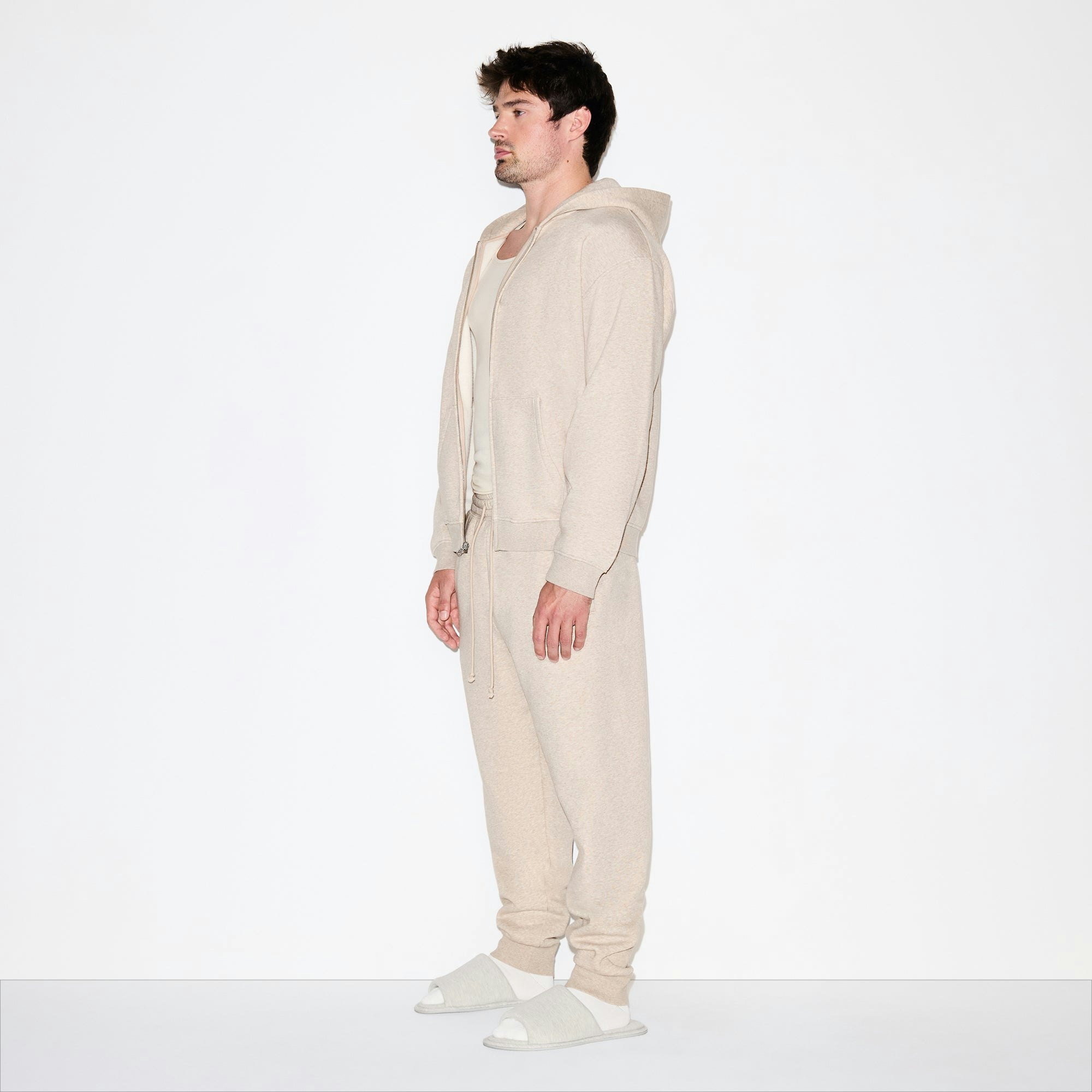 FLEECE LOUNGE MENS RELAXED ZIP UP HOODIE | DESERT HEATHER ON A MODEL FRONT VIEW @ | FOCUS: 0.0, 1.0, 0.9