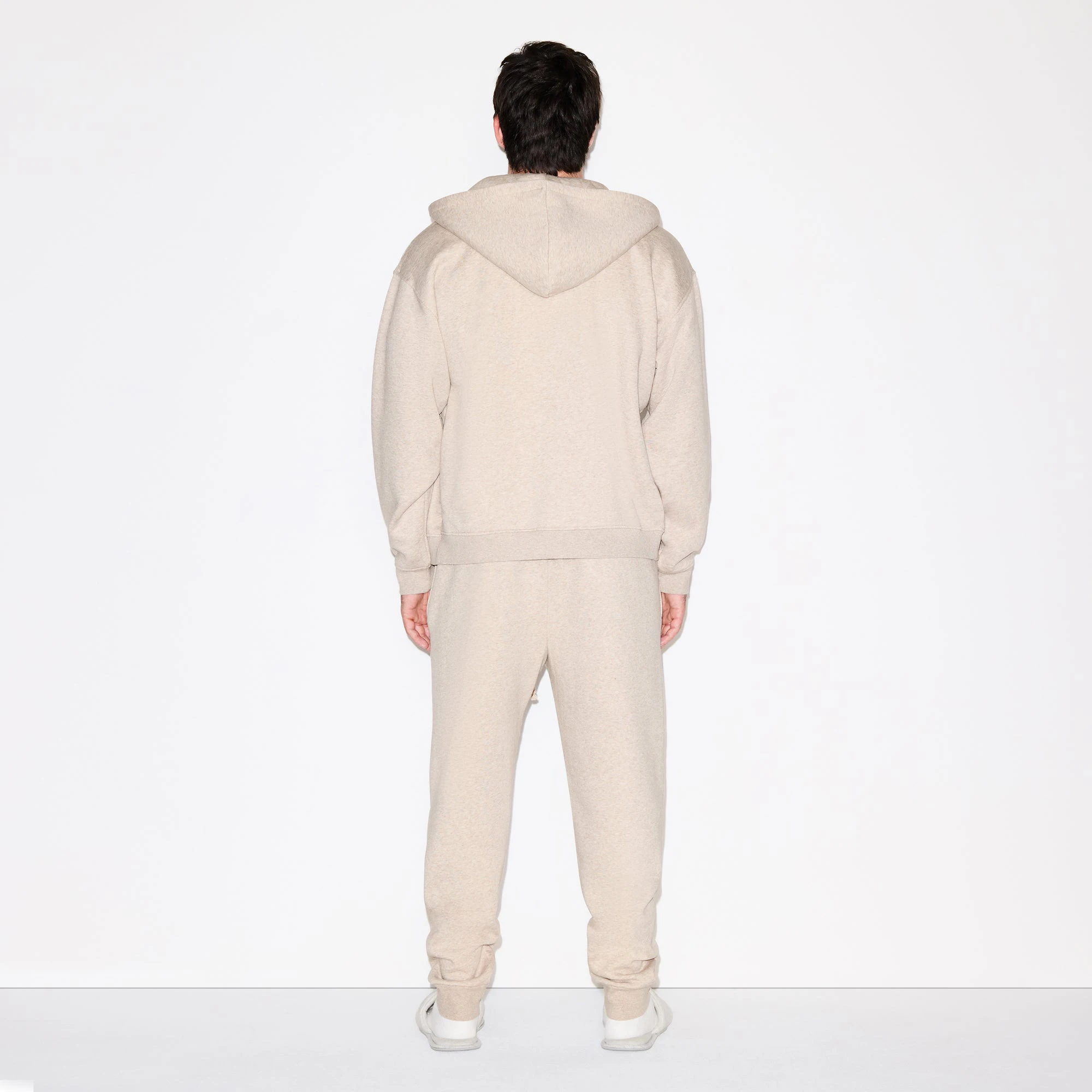 FLEECE LOUNGE MENS RELAXED ZIP UP HOODIE | DESERT HEATHER ON A MODEL FRONT VIEW @ | FOCUS: 0.0, 1.0, 0.9