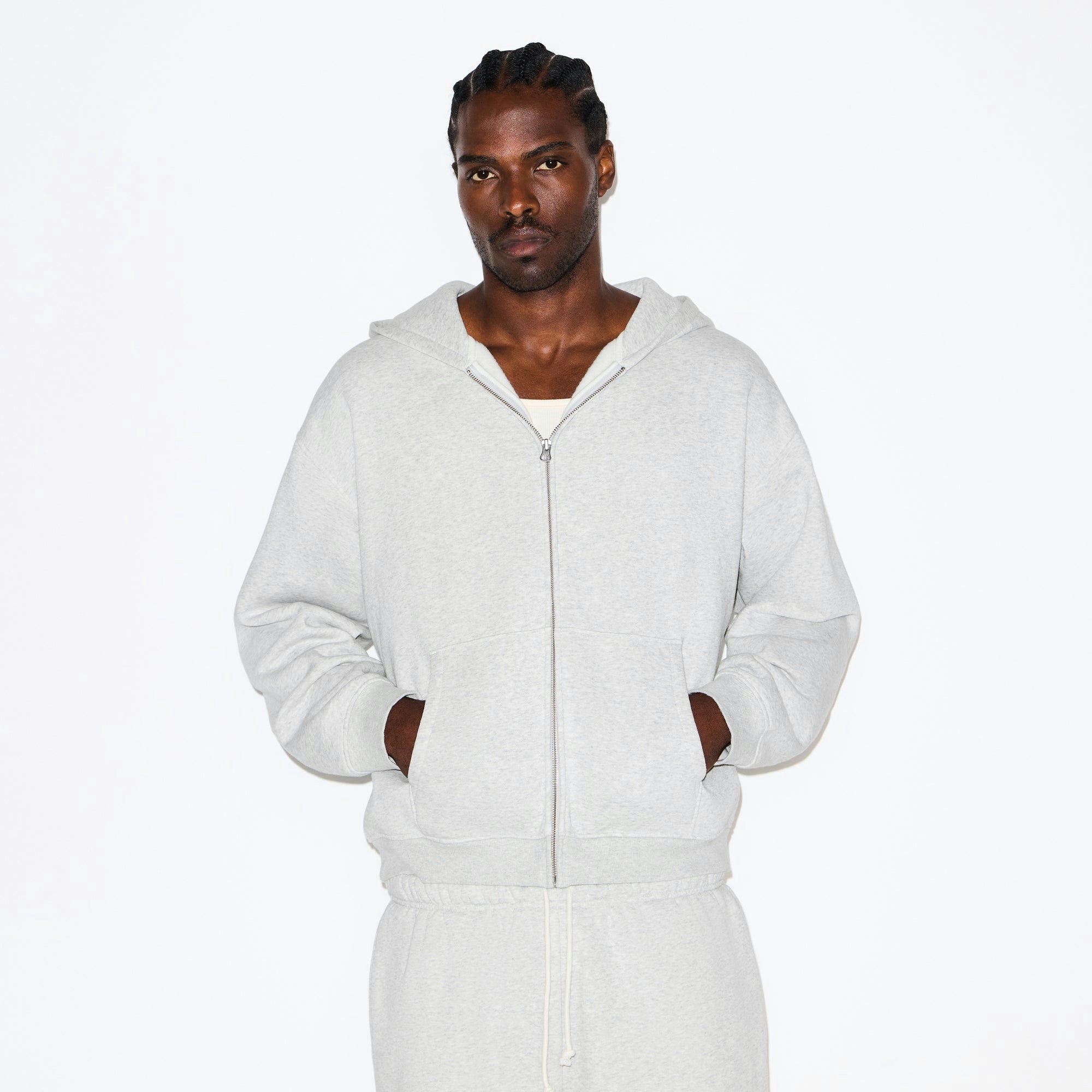 FLEECE LOUNGE MENS RELAXED ZIP UP HOODIE | LIGHT HEATHER GREY ON A MODEL SIDE VIEW @ | FOCUS: 0.0, 1.0, 0.9