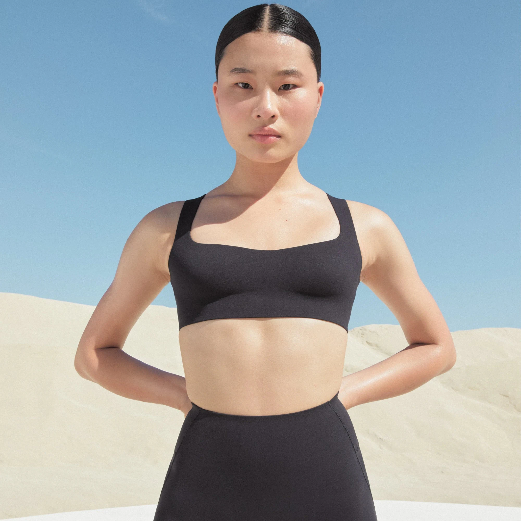NikeSKIMS STUDIO STRETCH SQUARE NECK RACER BRA | OBSIDIAN ON A MODEL FRONT VIEW @ | FOCUS: 0.0, 1.0, 0.9