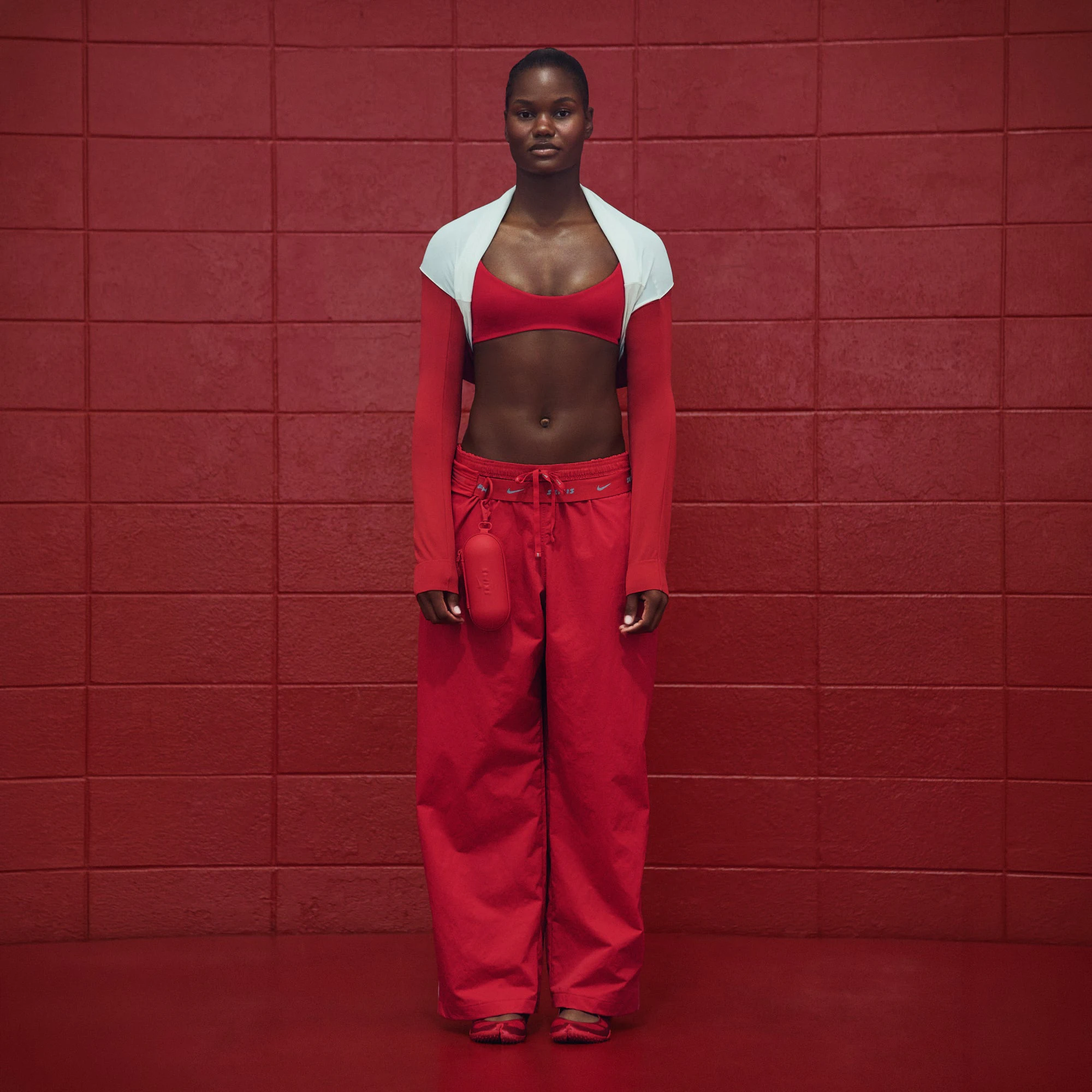 NikeSKIMS CRUNCHY NYLON WIDE LEG PANT | UNIVERSITY RED ON A MODEL EDITORIAL @ | FOCUS: 0.0, 1.0, 0.9