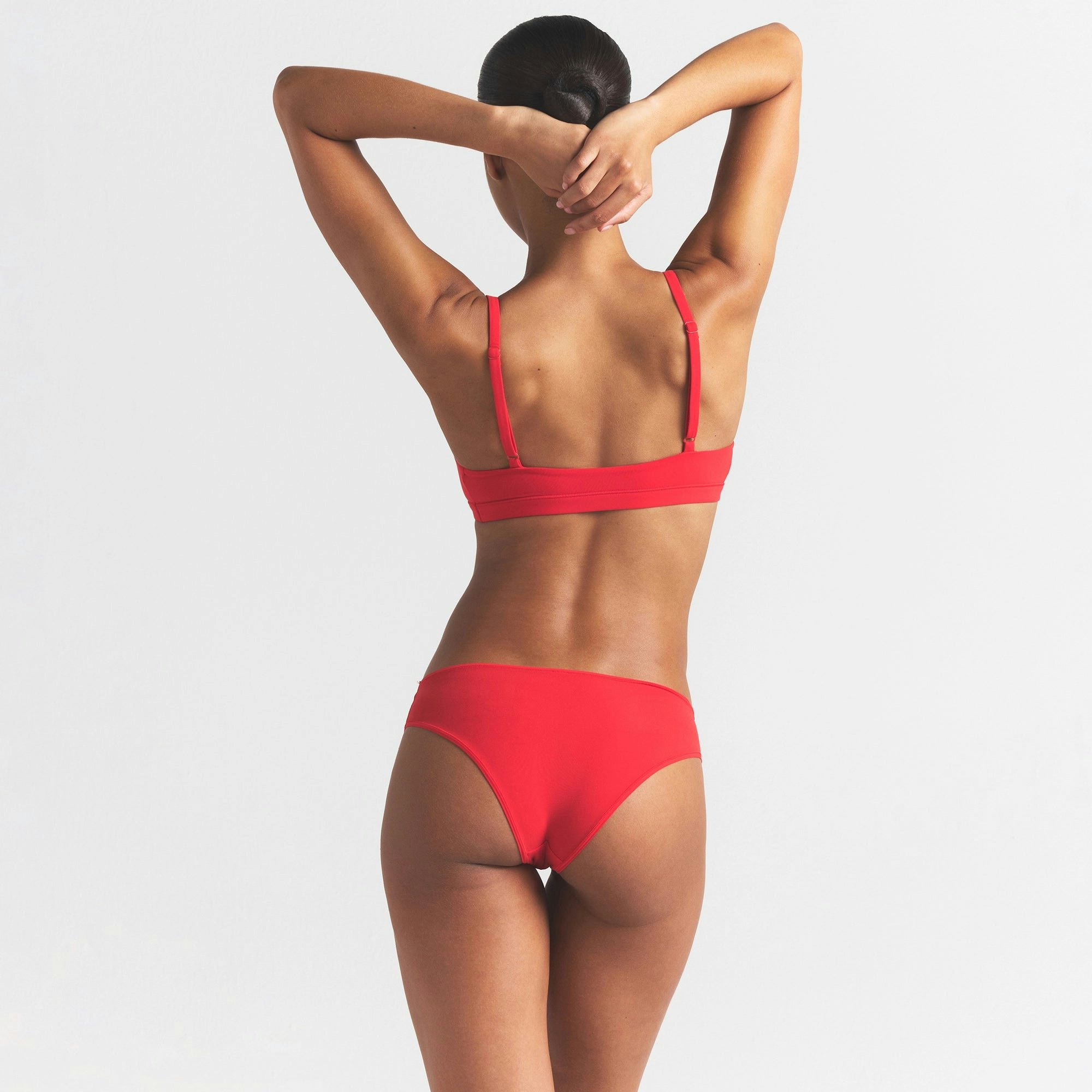 FITS EVERYBODY CHEEKY BRIEF | CHERRY ON A MODEL SIDE VIEW @ | FOCUS: 0.0, 1.0, 0.9