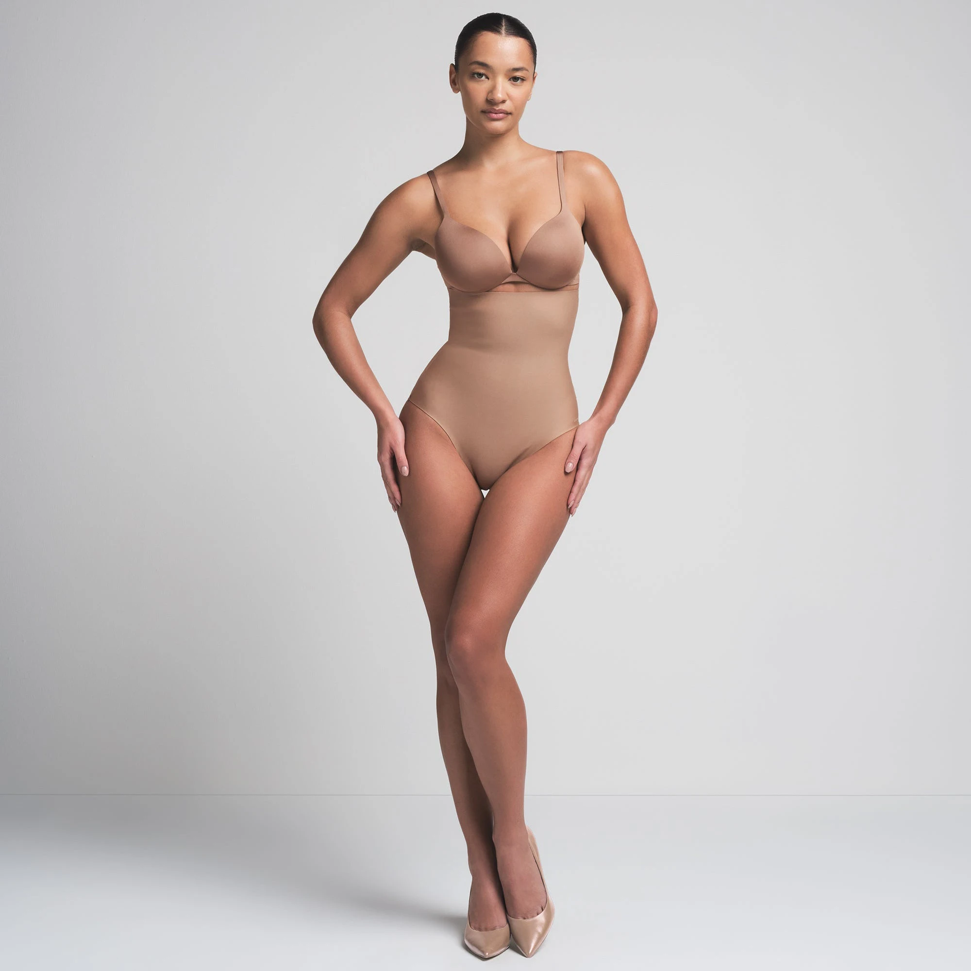 SKIMS BODY CORE SCULPT HIGH-WAISTED BRIEF | SIENNA ON A MODEL FRONT VIEW