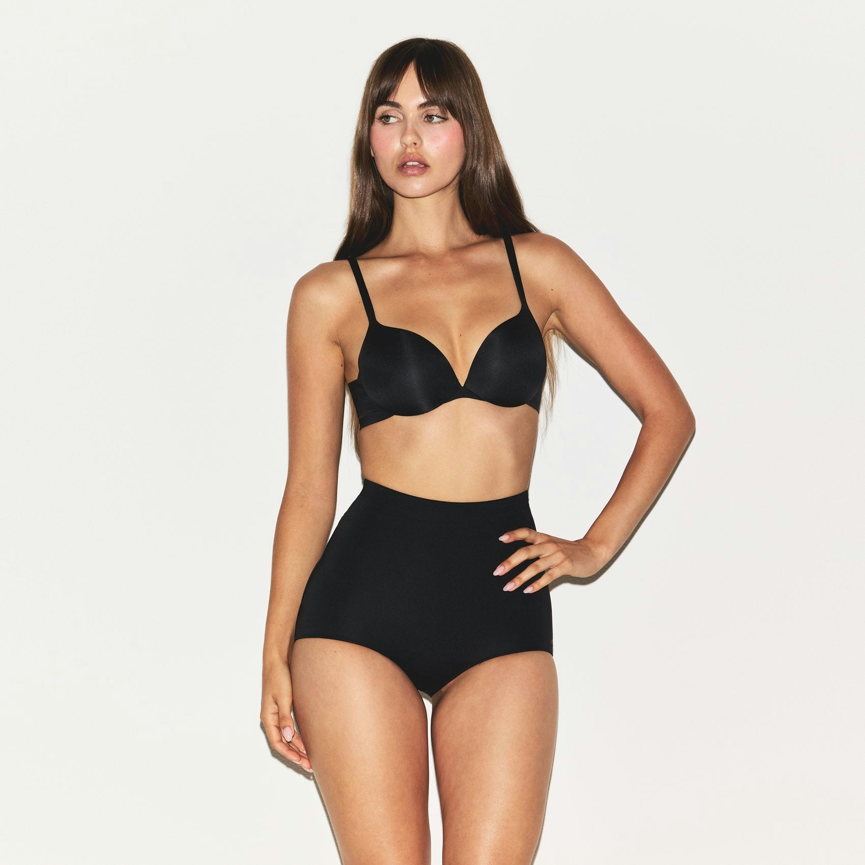 SKIMS BODY BUTT ENHANCING BRIEF | ONYX ON A MODEL SIDE VIEW @ | FOCUS: 0.0, 1.0, 0.9