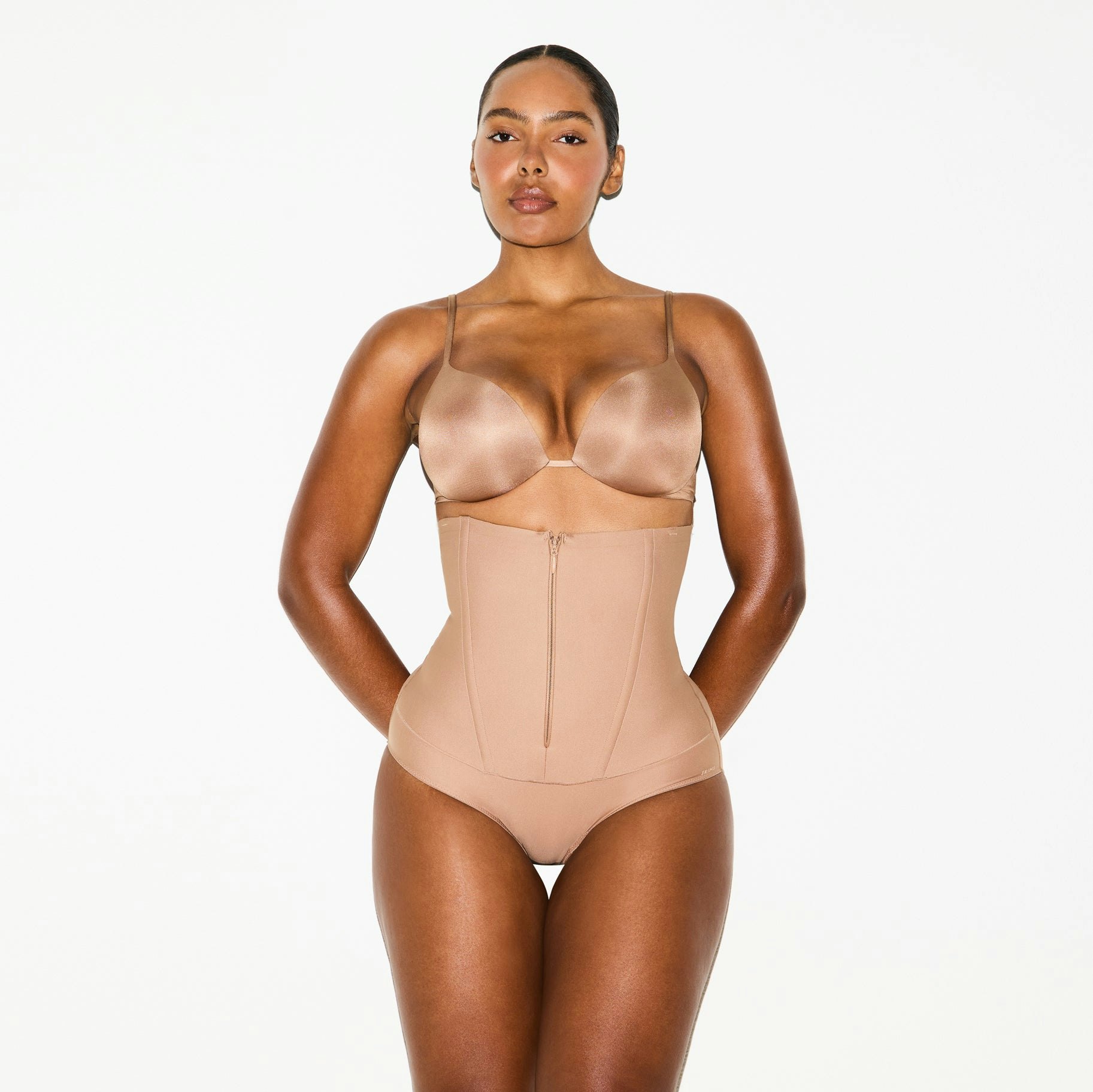 SKIMS BODY CORE SCULPT WAIST CINCHER BUTT LIFTING BRIEF | SIENNA ON A MODEL SIDE VIEW @ | FOCUS: 0.0, 1.0, 0.9