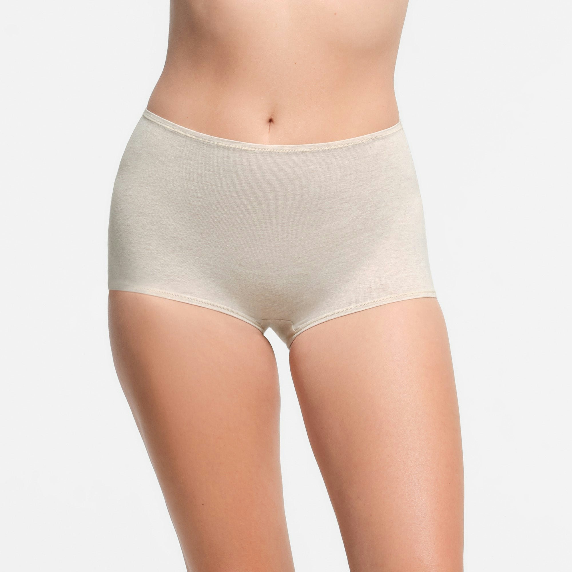 COTTON JERSEY BOY SHORT | OATMEAL HEATHER ON A MODEL FRONT VIEW | FOCUS: 0.9, 0.1, 0.7