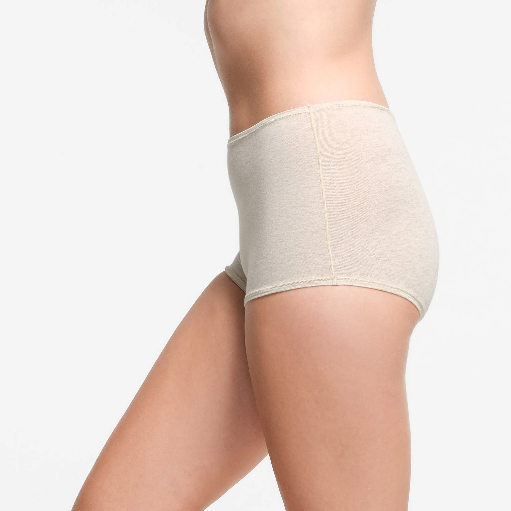 COTTON JERSEY BOY SHORT | OATMEAL HEATHER ON A MODEL SIDE VIEW