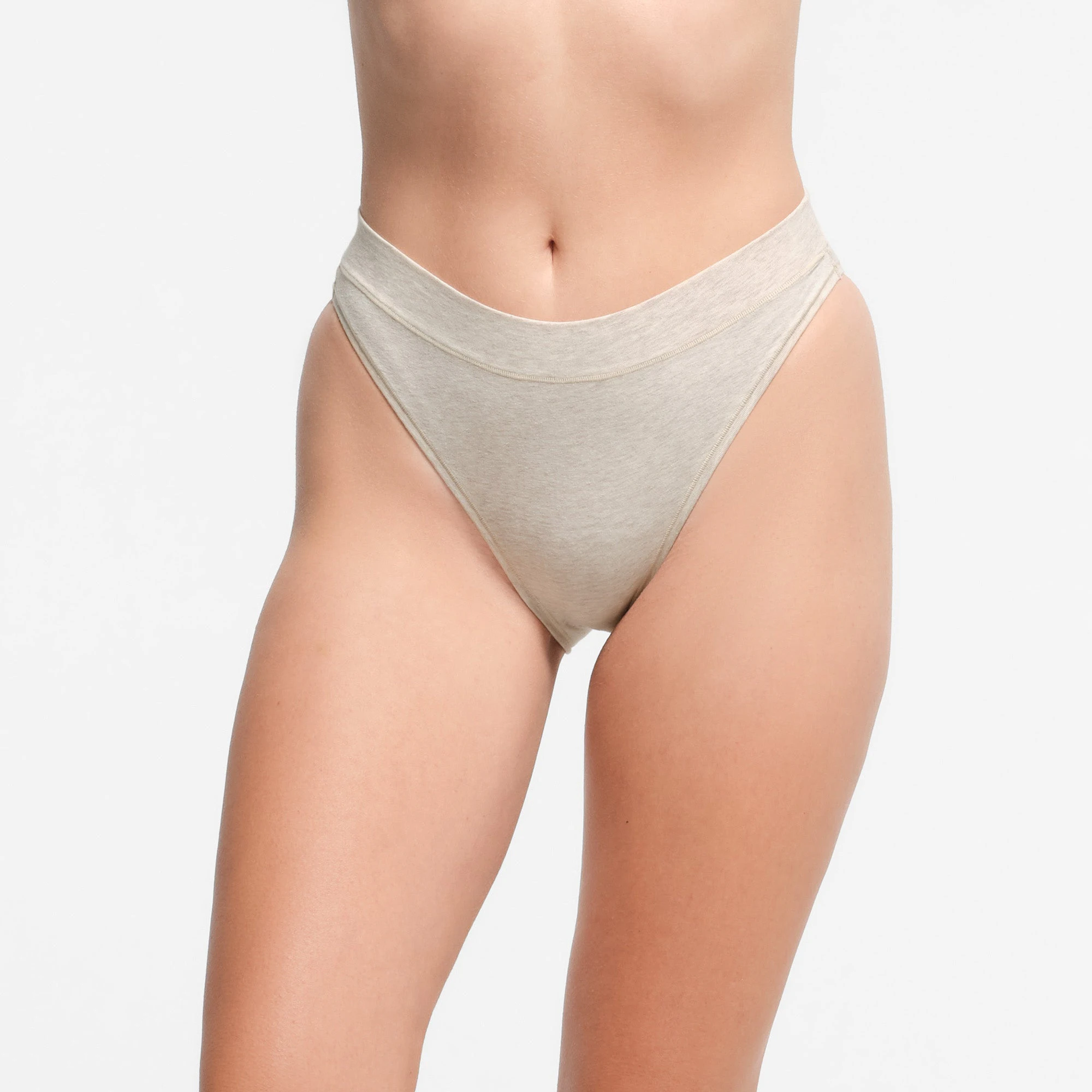 COTTON JERSEY CHEEKY TANGA | OATMEAL HEATHER ON A MODEL FRONT VIEW | FOCUS: 0.9, 0.1, 0.7