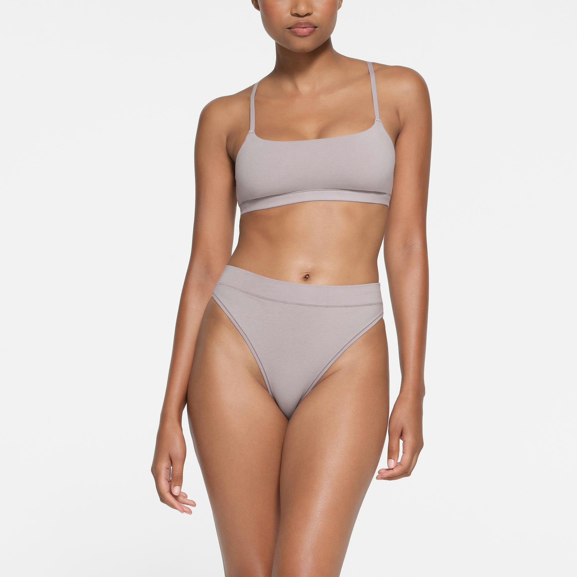COTTON JERSEY CHEEKY TANGA | OYSTER ON A MODEL FRONT VIEW
