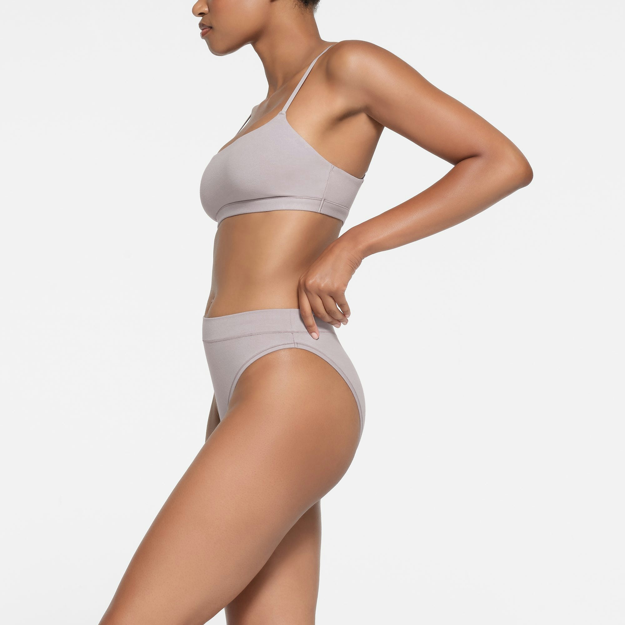 COTTON JERSEY CHEEKY TANGA | OYSTER ON A MODEL SIDE VIEW